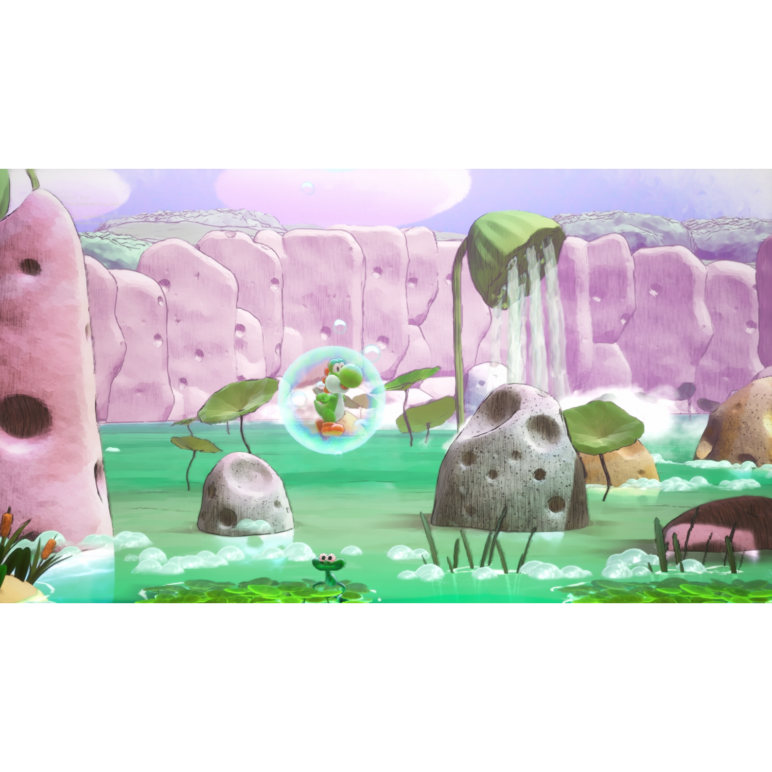 Yoshi in a bubble swims in a green pond with rocks and waterfalls.