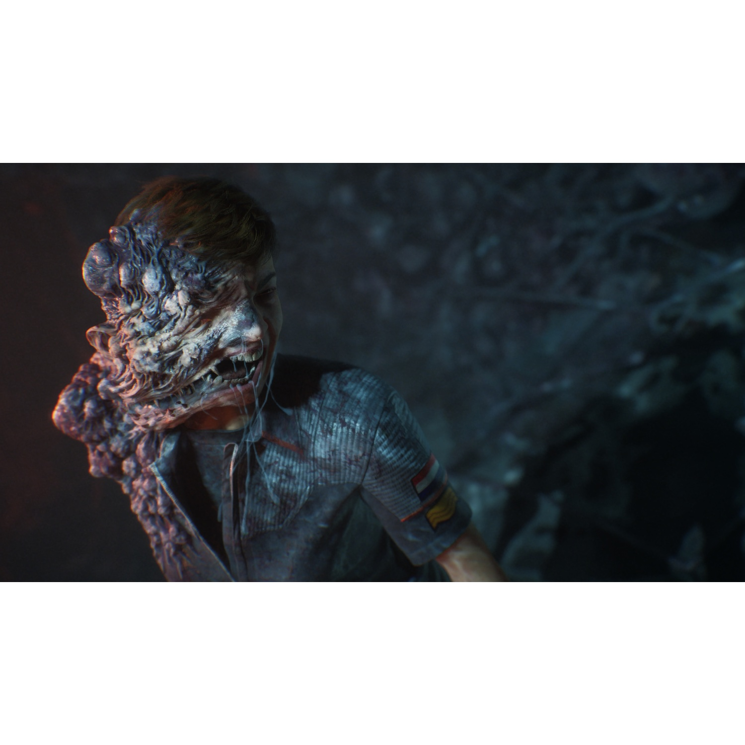 A mutated creature with a decaying face and open mouth in a dark environment.