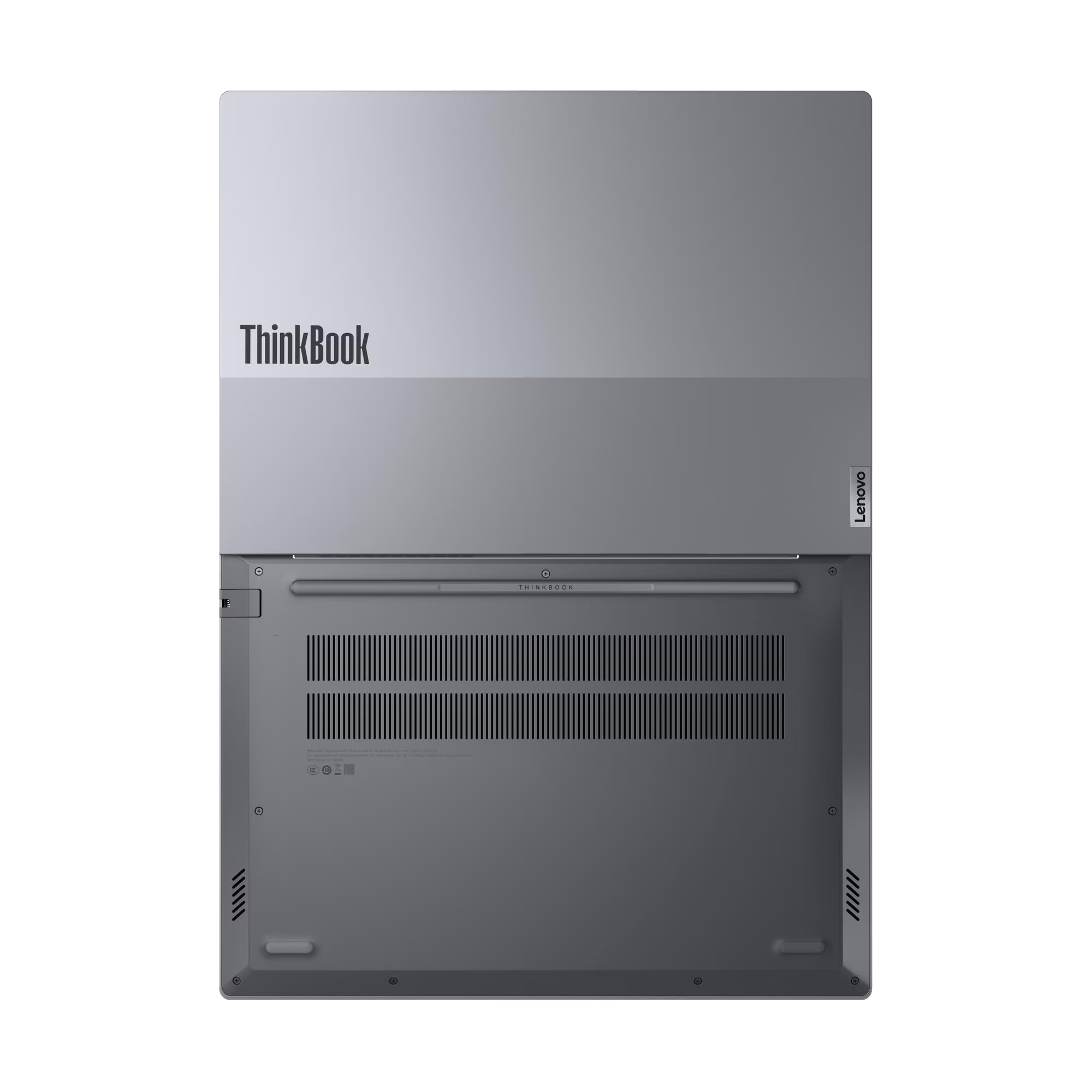 Parte inferior de un portátil gris Lenovo ThinkBook, mostrando rejillas y logos.