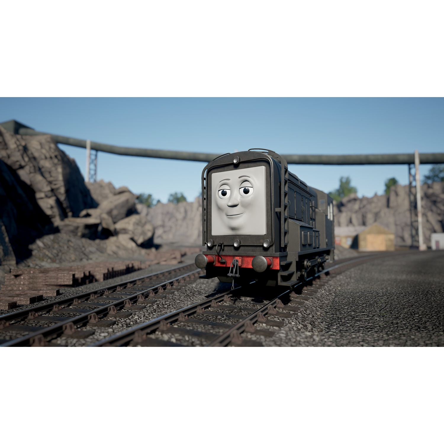 Een donkere motor met een gezicht rijdt op treinrails door een rotsachtig landschap.