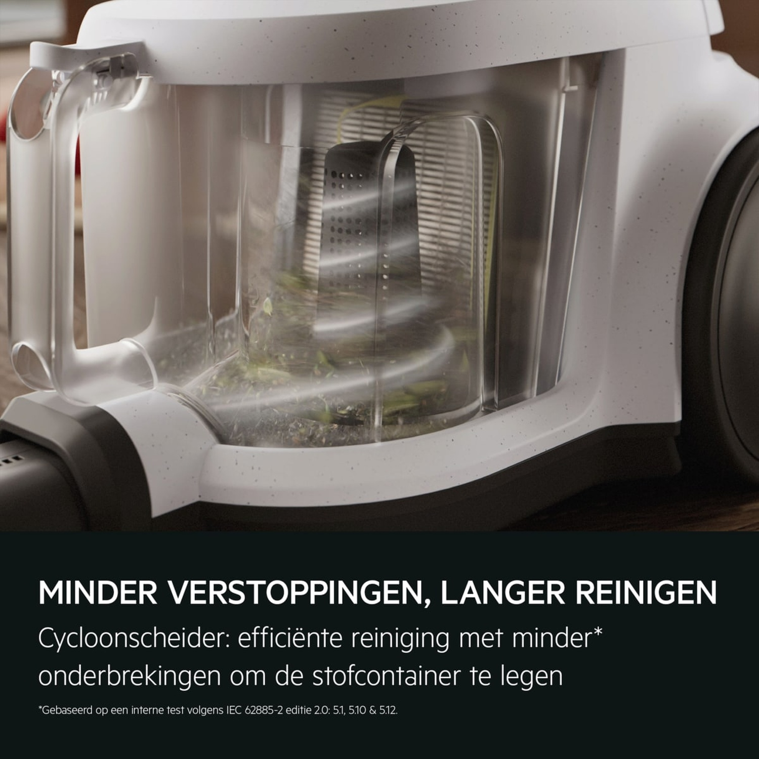 A white vacuum cleaner dustbin with debris inside, and text.