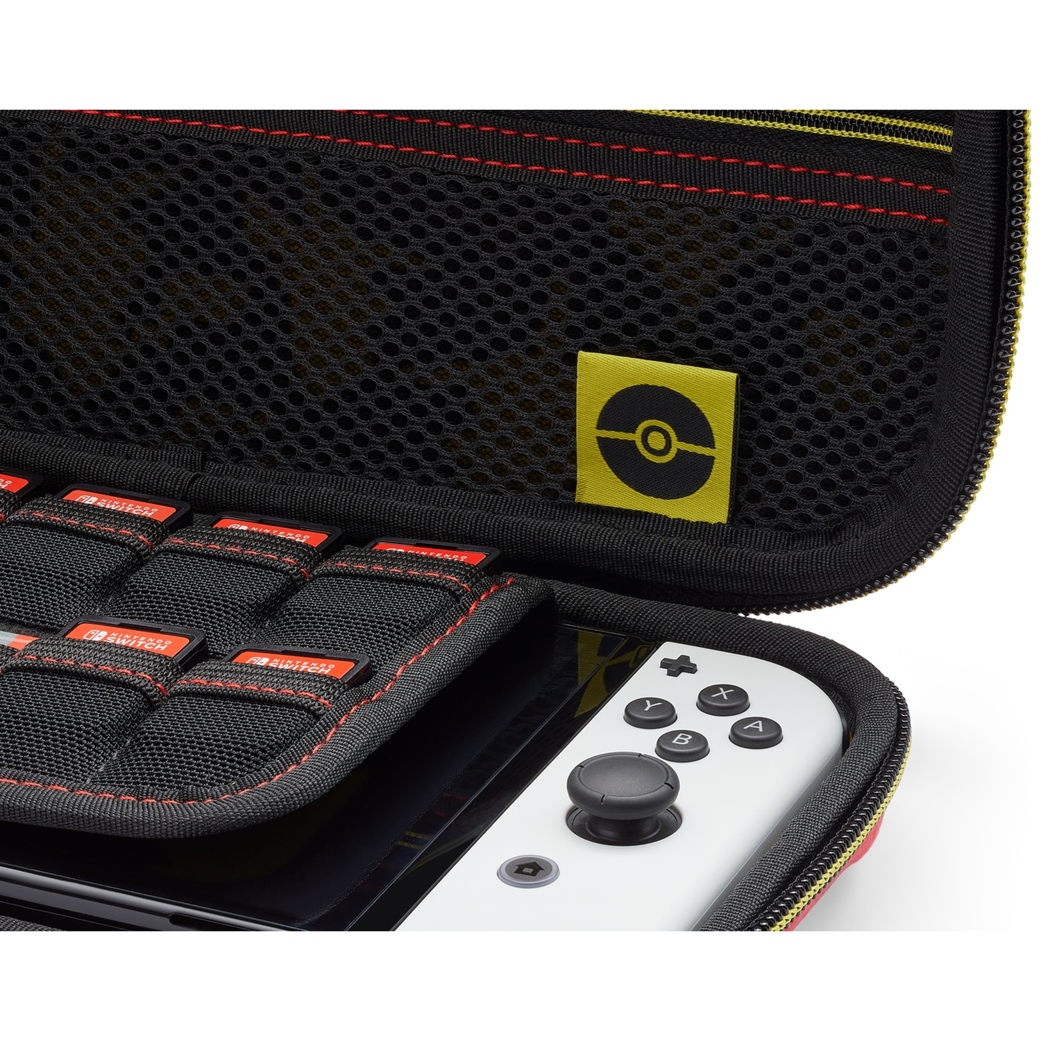 A Nintendo Switch case with game card slots and a white controller.