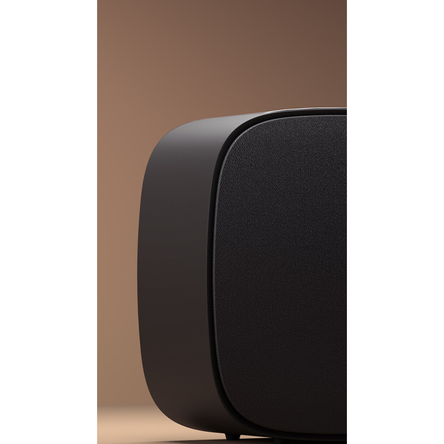 A black speaker with a fabric grille against a brown background.