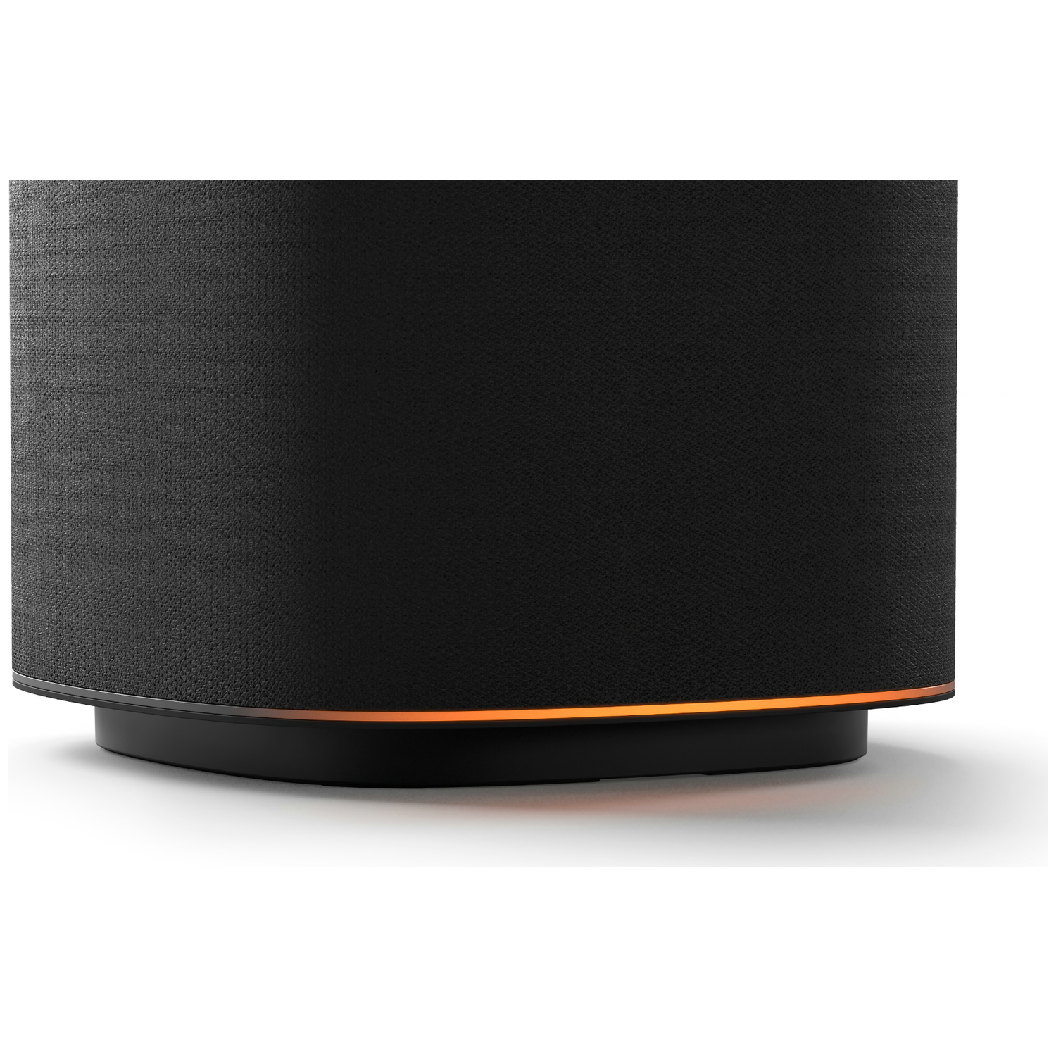 Black speaker with orange lighting at the base on a white background.