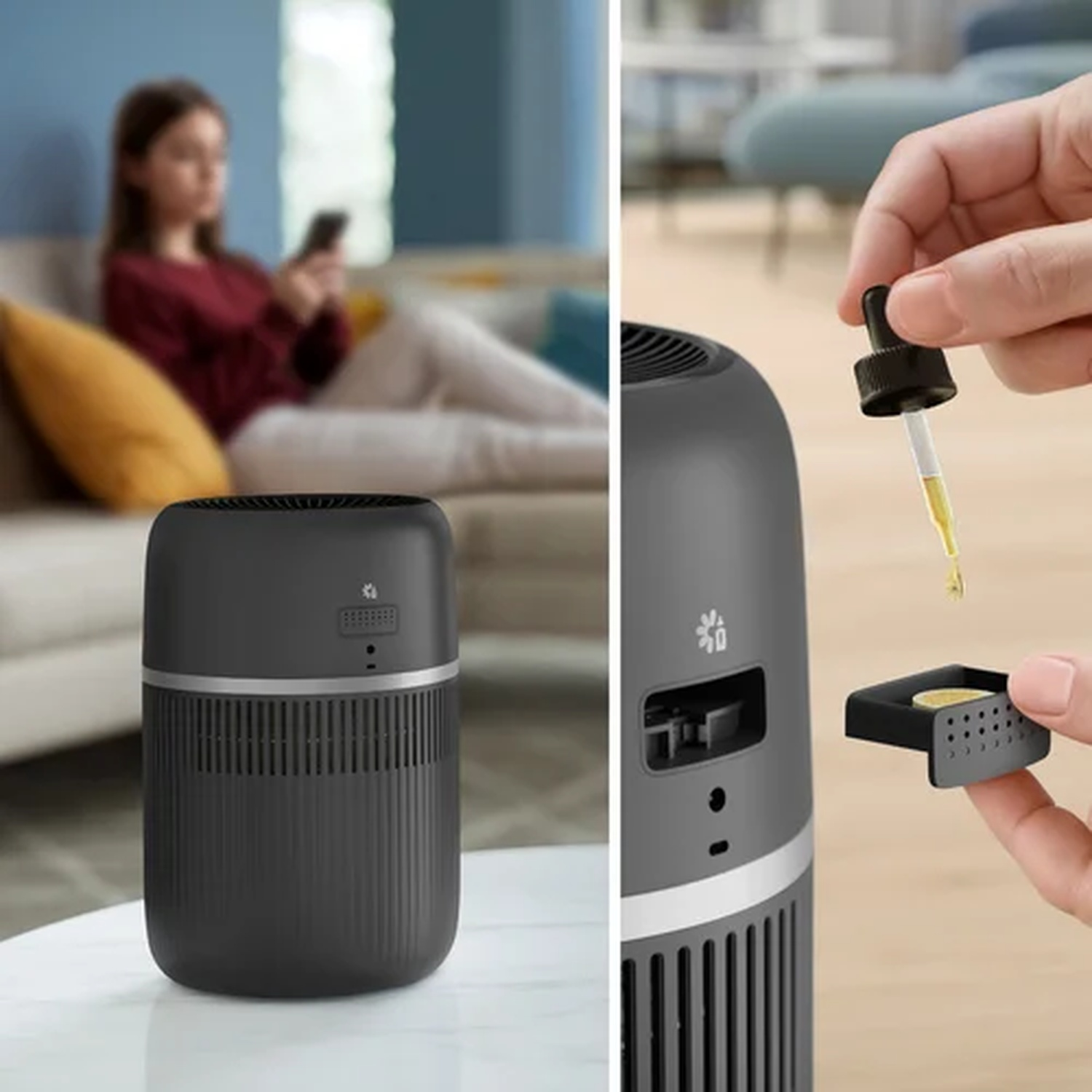 A diffuser sits on a table, with a woman on a sofa in the background.