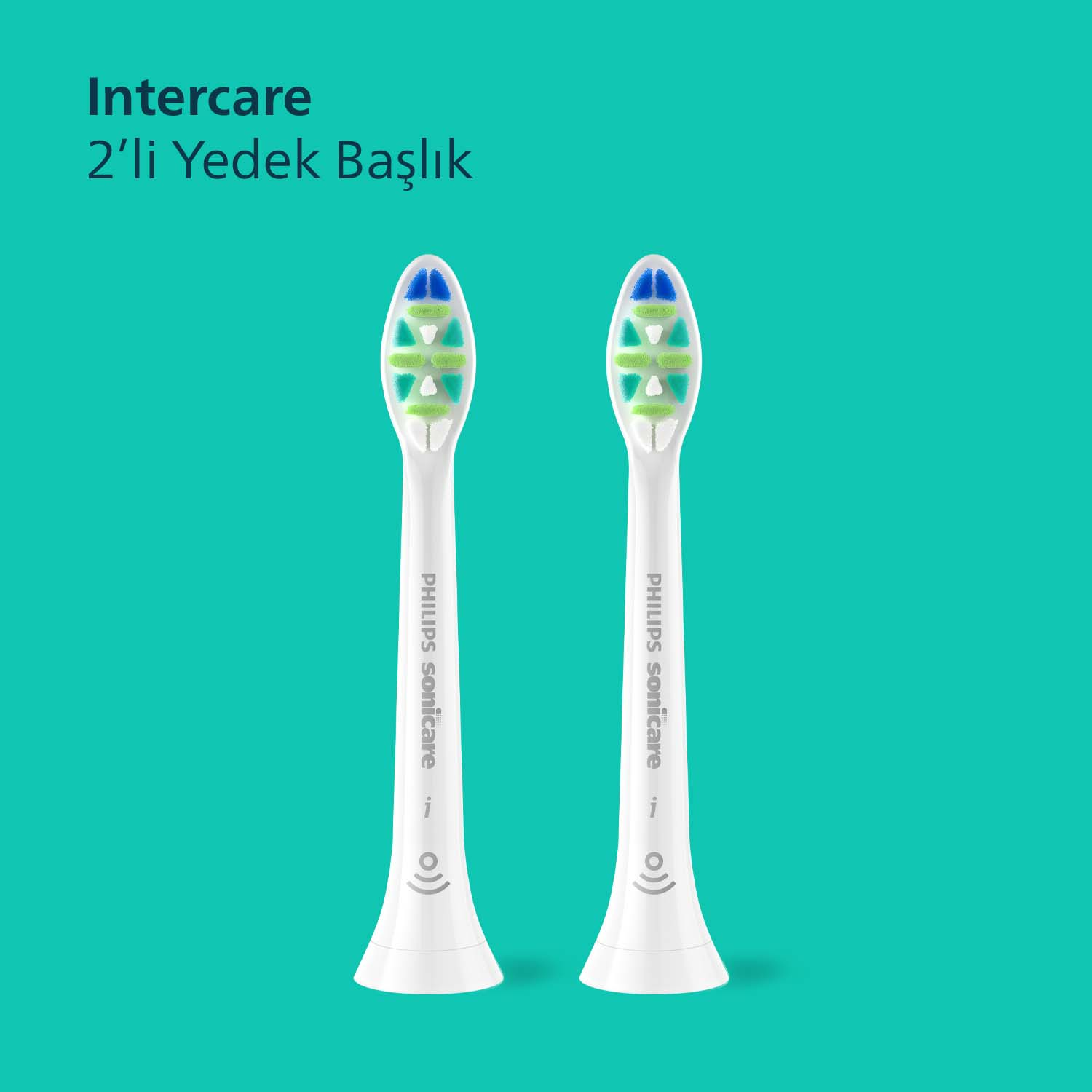 Turkuaz arka planda mavi ve yeşil kıllı iki beyaz Philips Sonicare fırça başlığı.