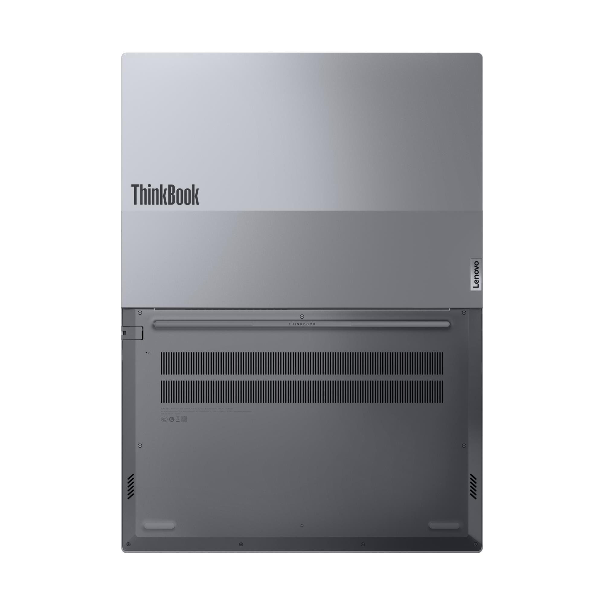 Egy zárt, ezüstszínű Lenovo ThinkBook laptop alulról, szellőzőnyílásokkal.