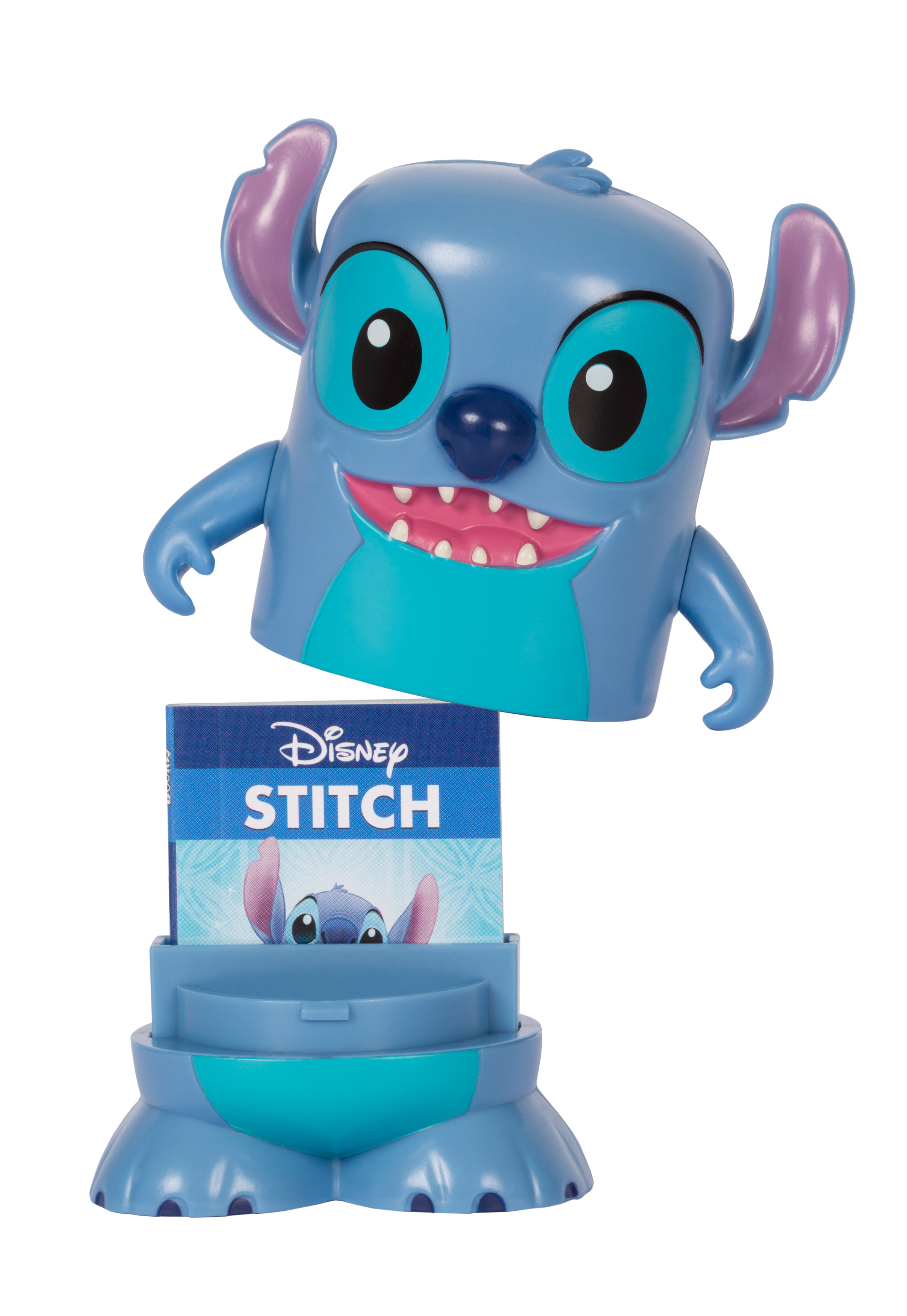 Eine blaue Stitch-Figur mit großen Augen und einem breiten Lächeln. Ein Buch mit Stitch ist sichtbar.