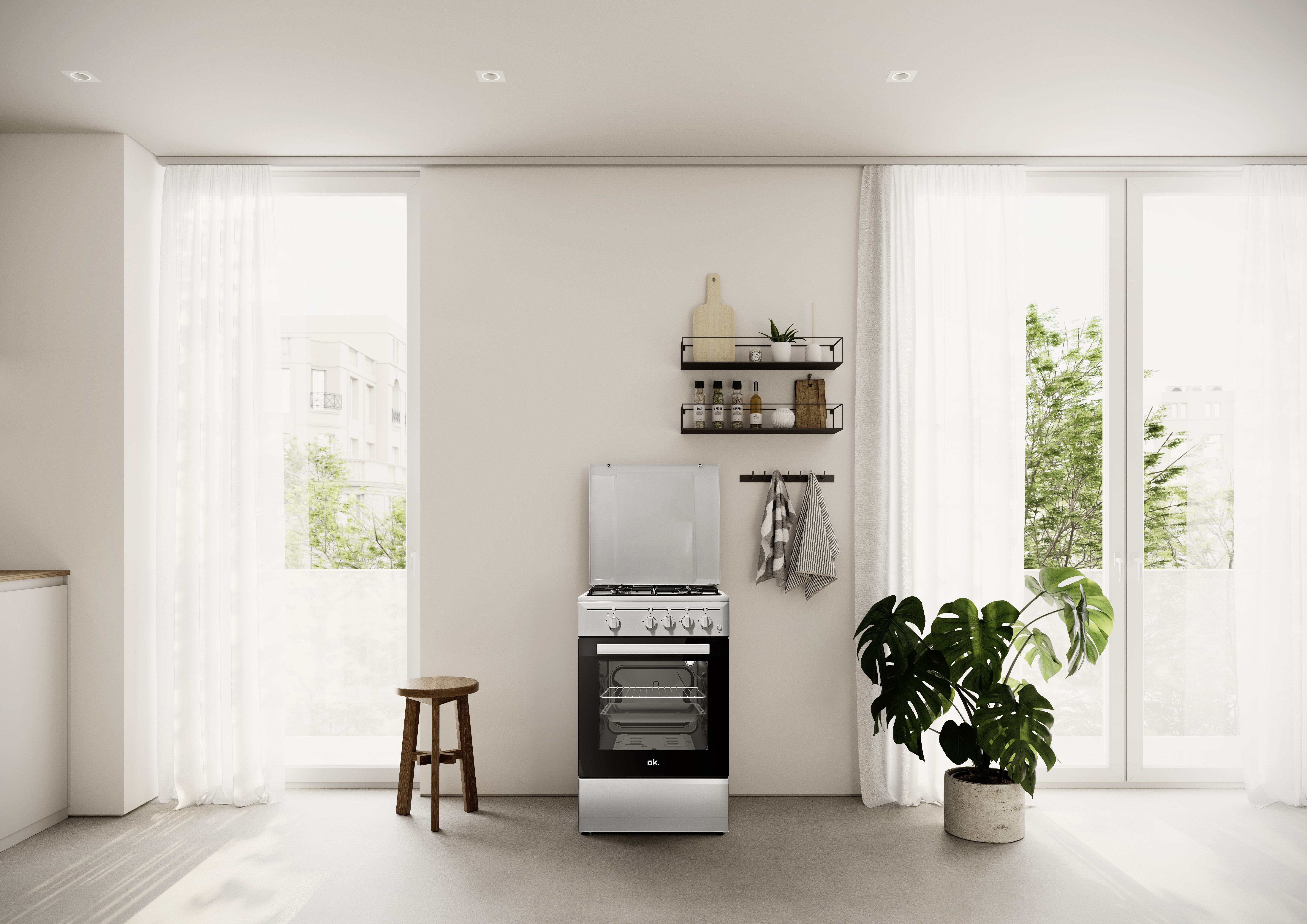 Una cocina moderna plateada se encuentra sobre un suelo gris.