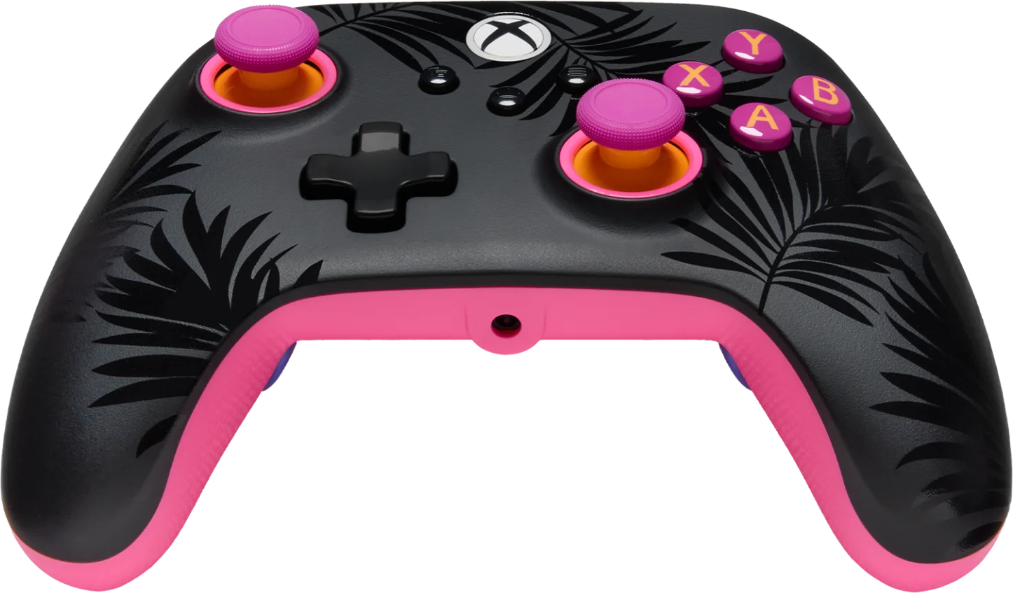 Fekete kontroller pálmalevél mintával, rózsaszín díszítéssel és sárga joystickkel.