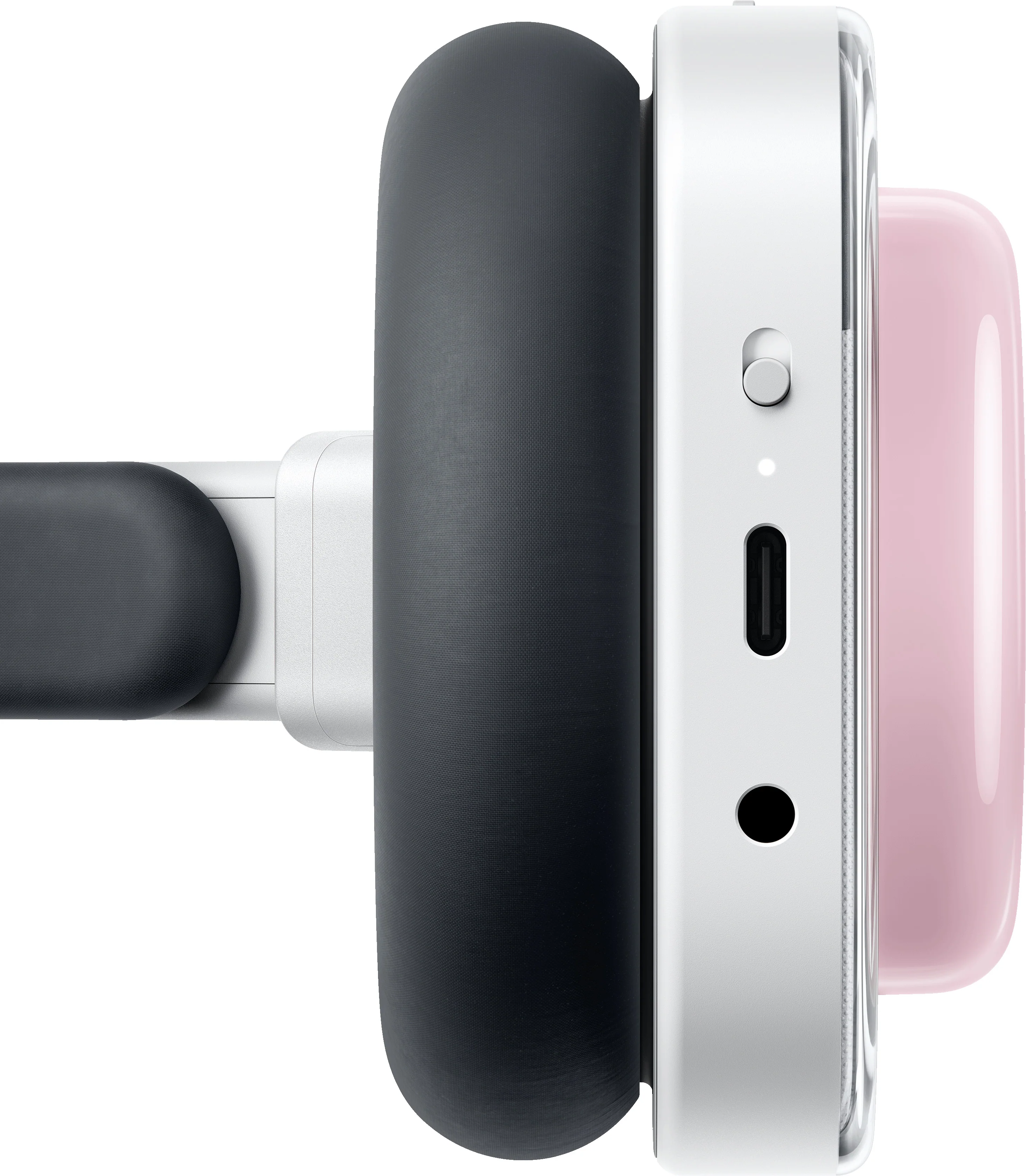 Gros plan d'un casque : écouteur foncé, boîtier blanc et élément rose. Port USB-C.