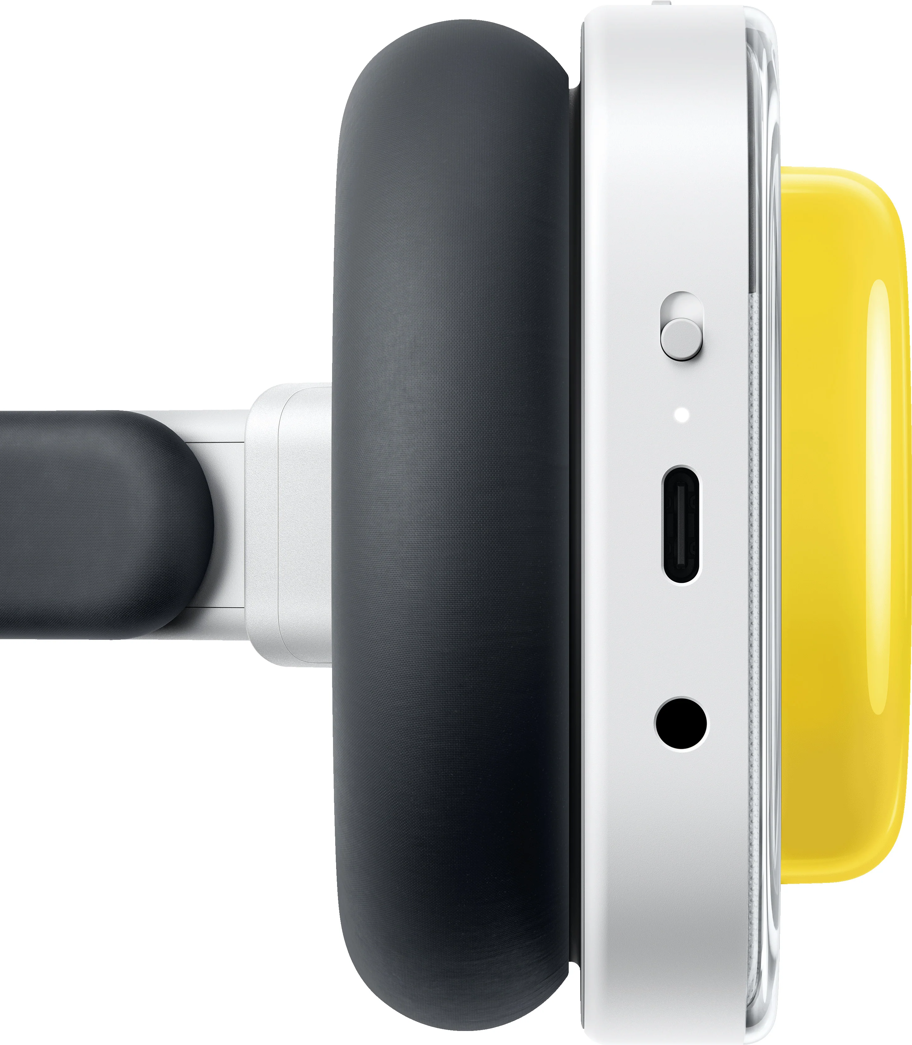Gros plan d'un casque avec écouteur noir, boîtier blanc et accent jaune.
