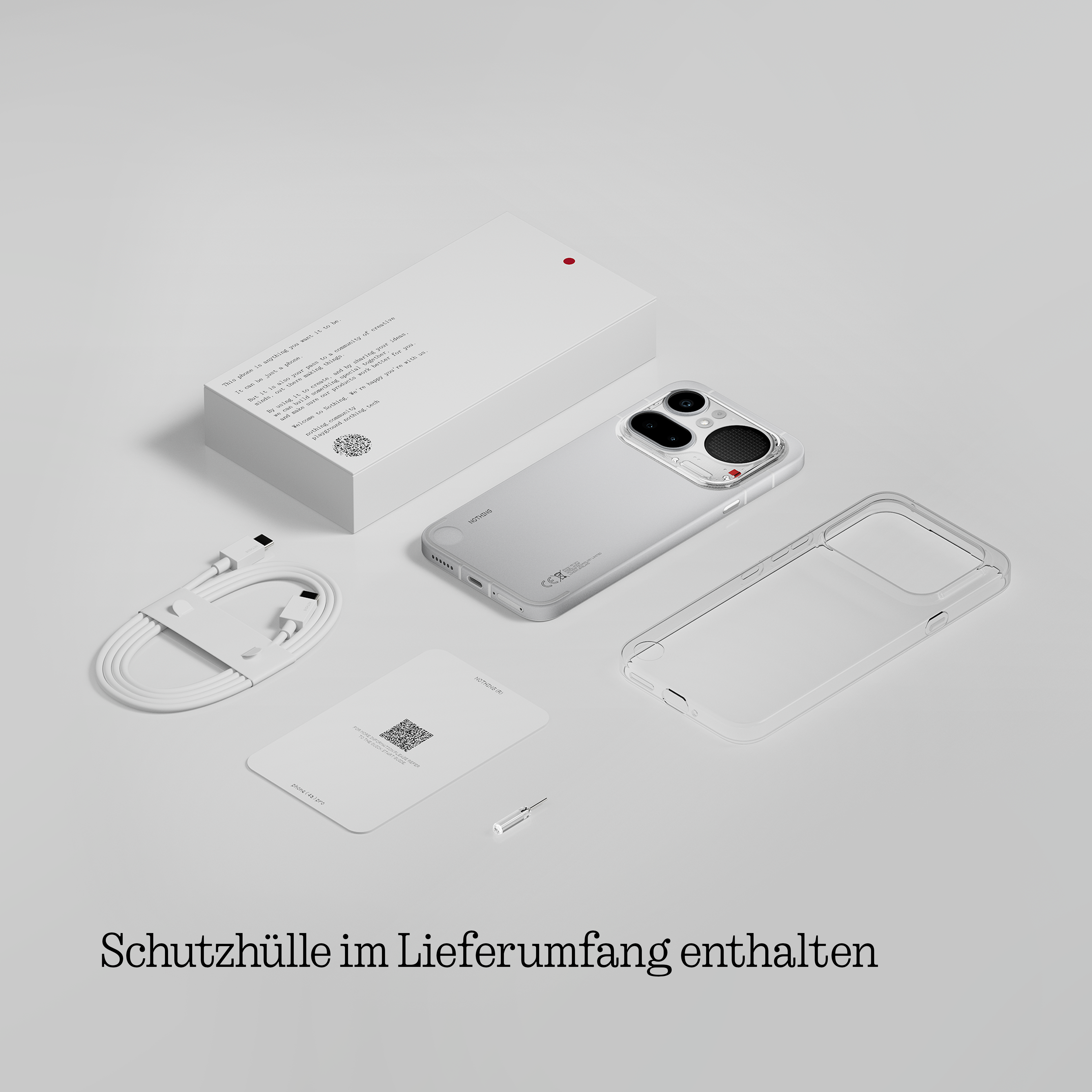 Ein Smartphone, Ladekabel, Hülle und Anleitung liegen auf einem grauen Untergrund.