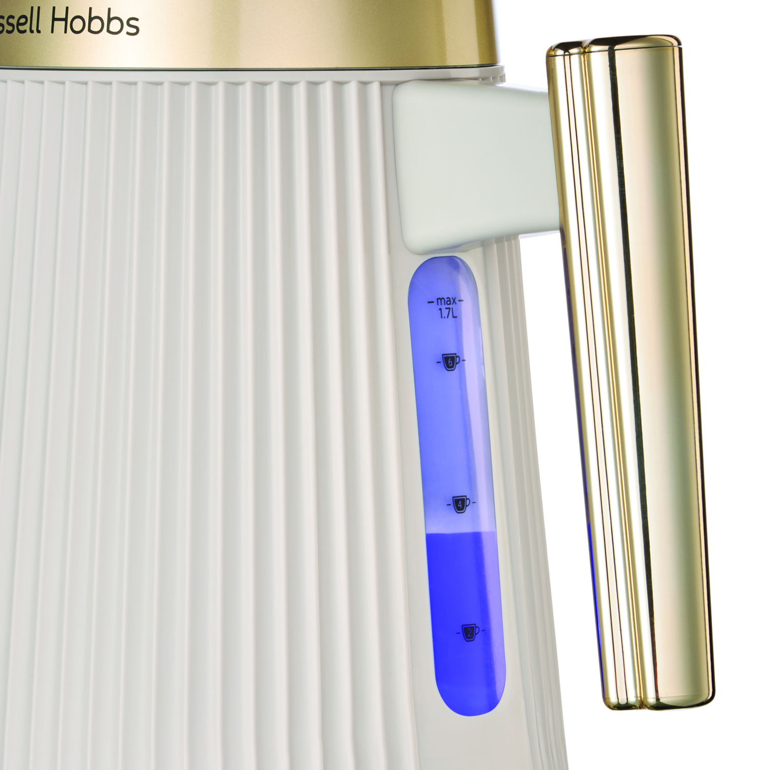 A white kettle with a ribbed design and a gold handle, showing water level.