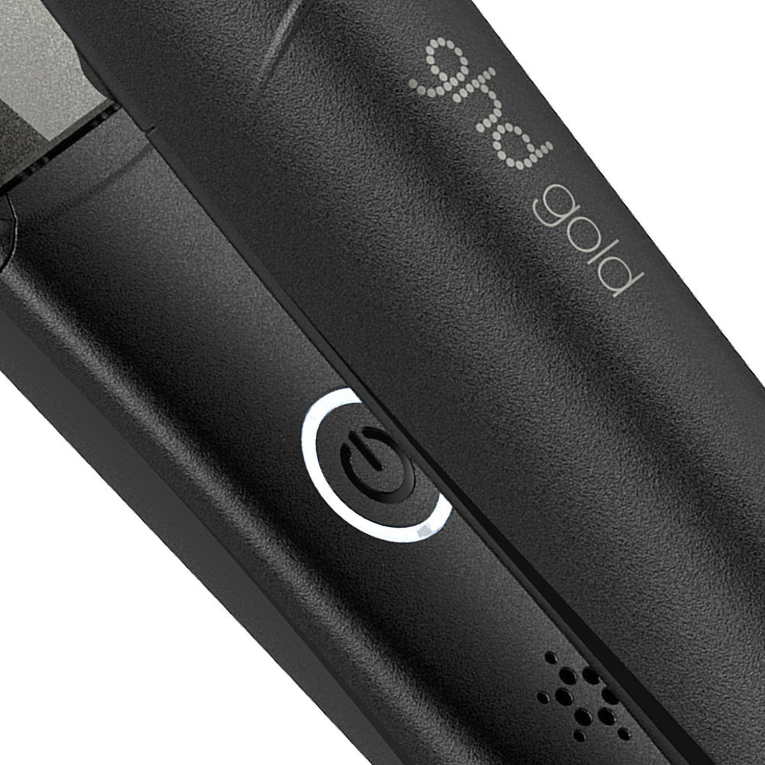 Black GHD Gold hair straightener with power button and vents.