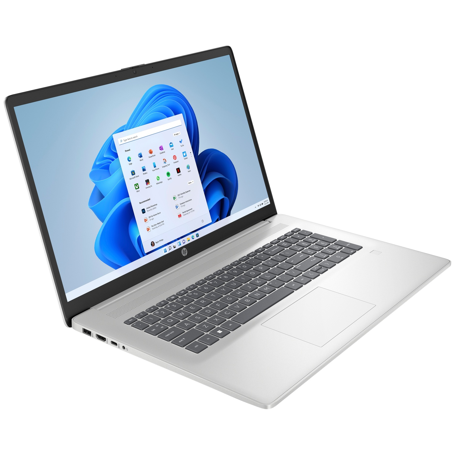 A silver laptop with a backlit keyboard and an open Windows 11 Start menu displayed.