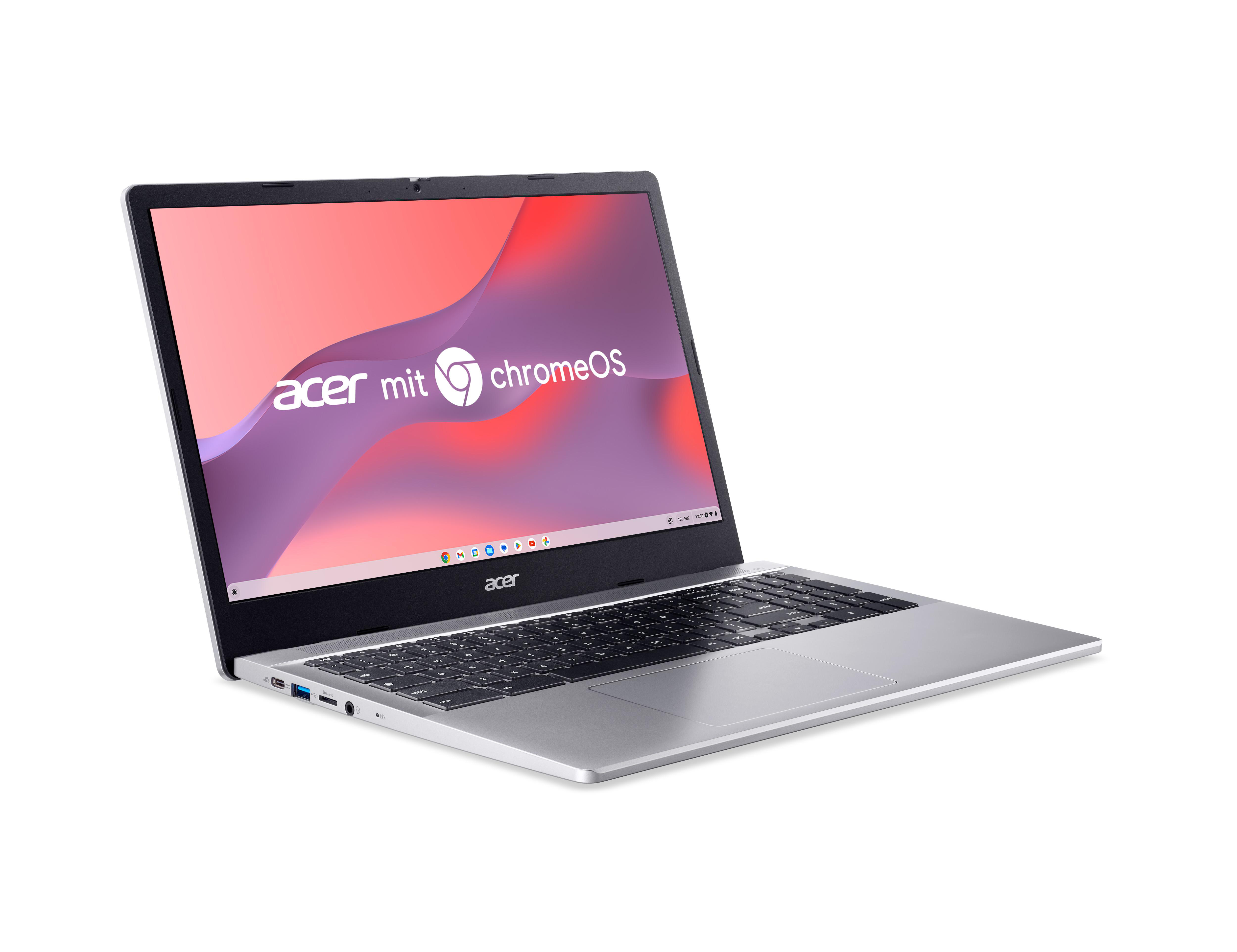 Ein geöffneter silberner Acer Chromebook mit ChromeOS-Hintergrund.