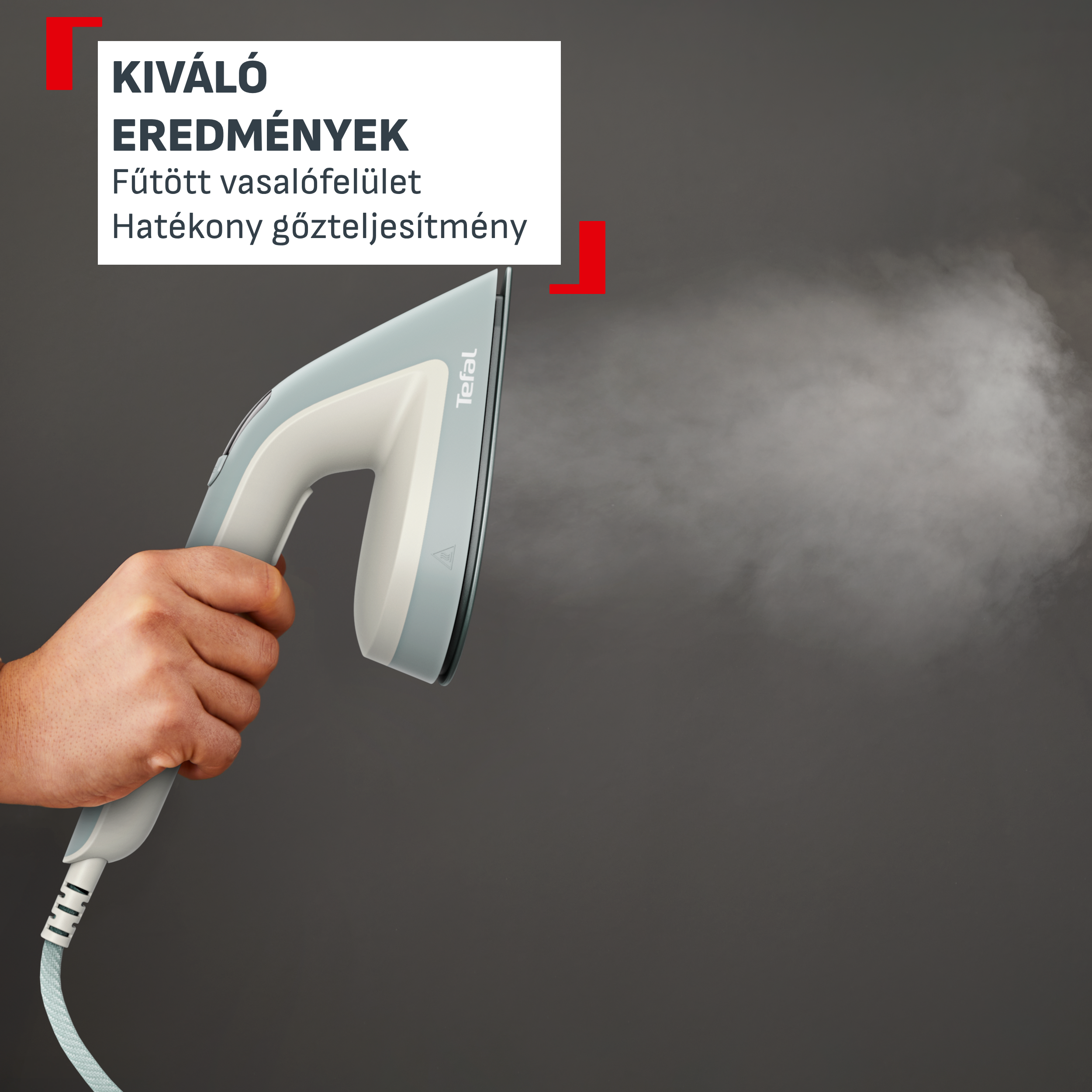 Egy kéz gőzölő vasalót tart. Felirat magyarul.