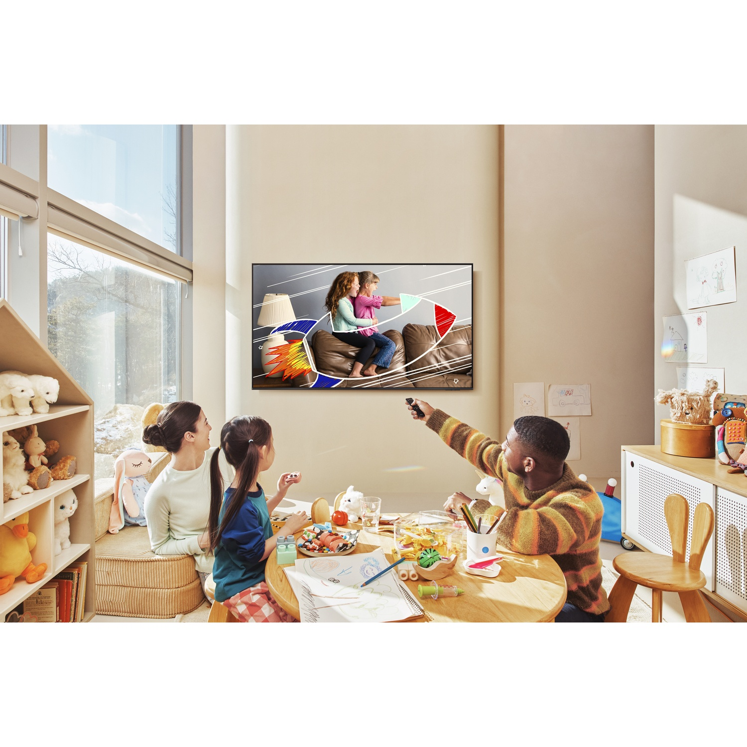 Family watches TV: Mother, two kids, and man sit at a table.