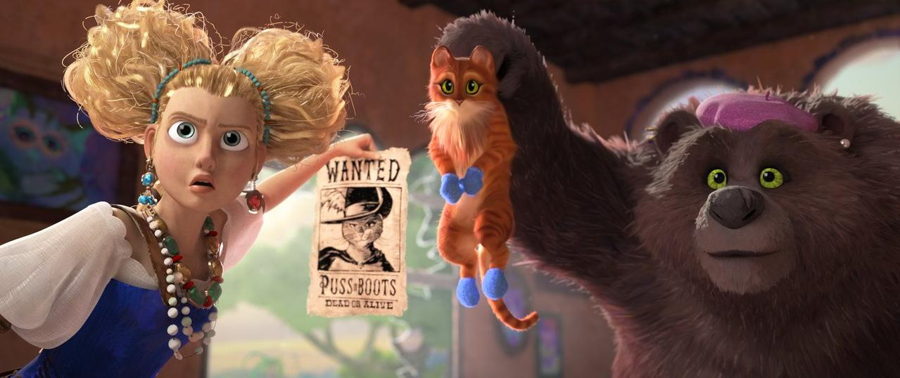 Ein Bär hält eine Katze, während eine Frau ein Steckbrief von "Puss in Boots" zeigt.