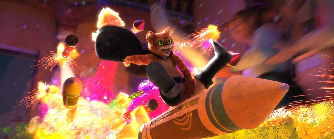 Puss in Boots reitet auf einer Rakete, umgeben von Explosionen und Funken.