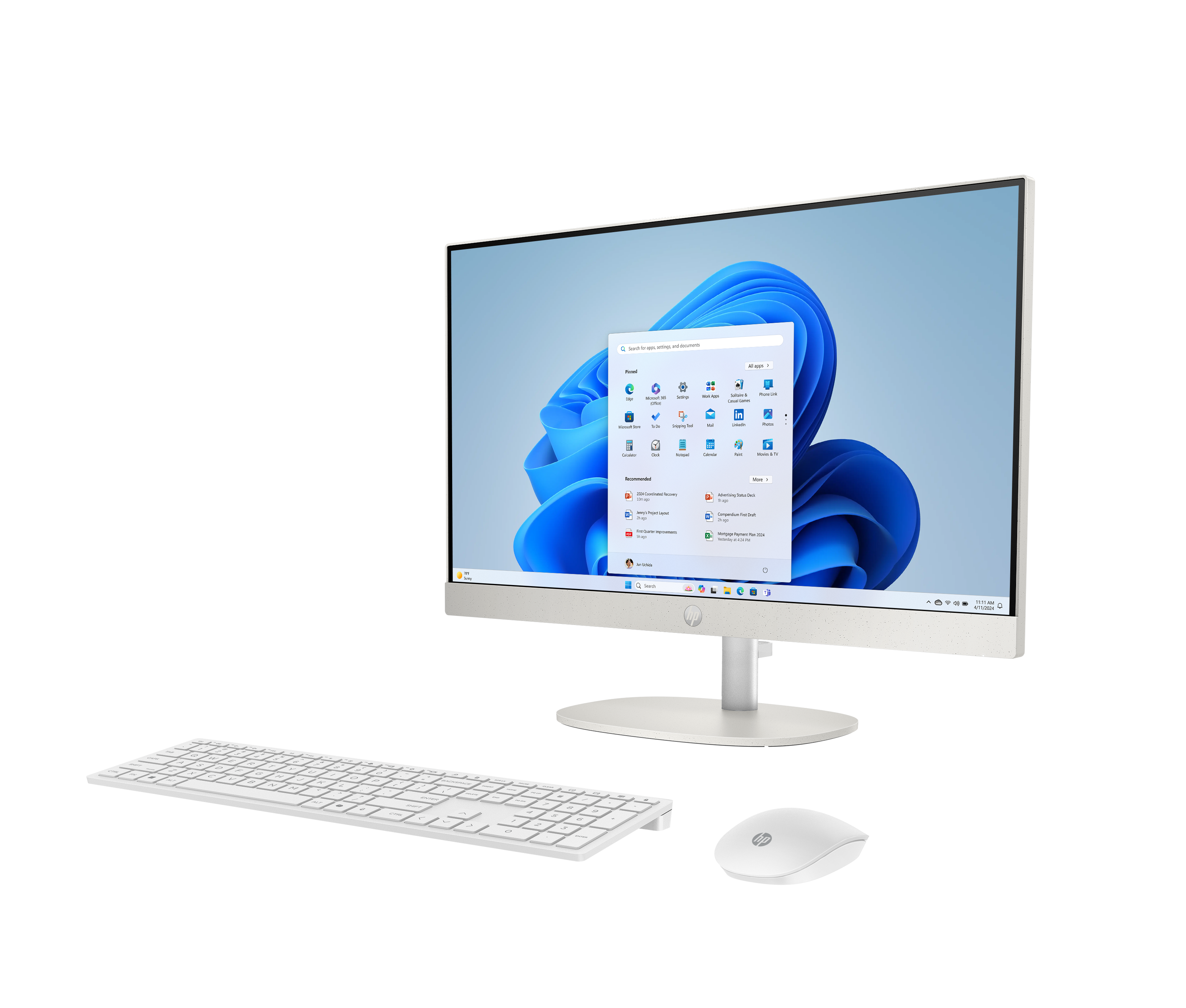 Een witte all-in-one computer met toetsenbord en muis op zwarte achtergrond.