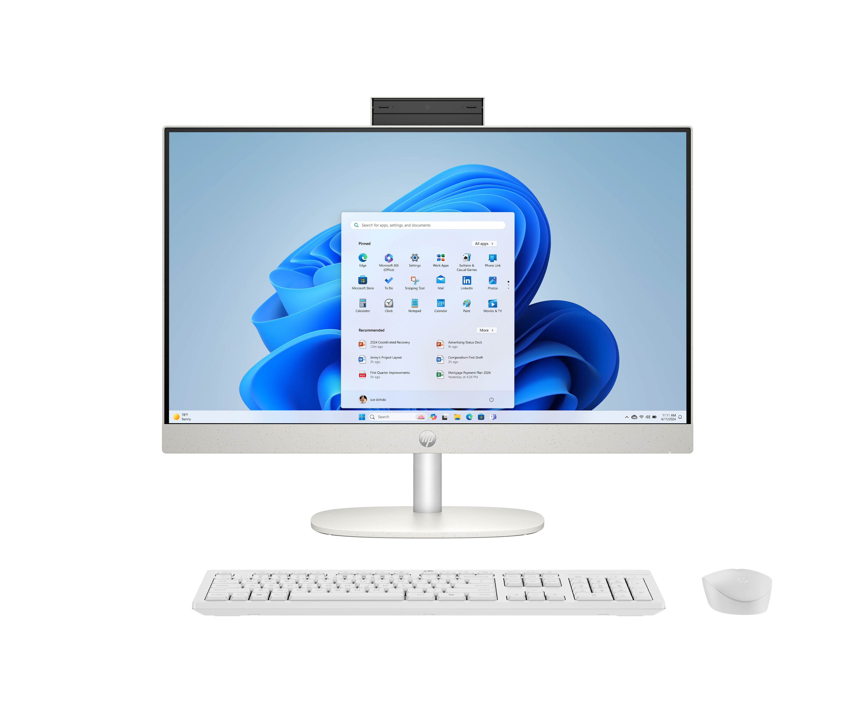 Een witte all-in-one computer met toetsenbord en muis wordt weergegeven op zwarte achtergrond.