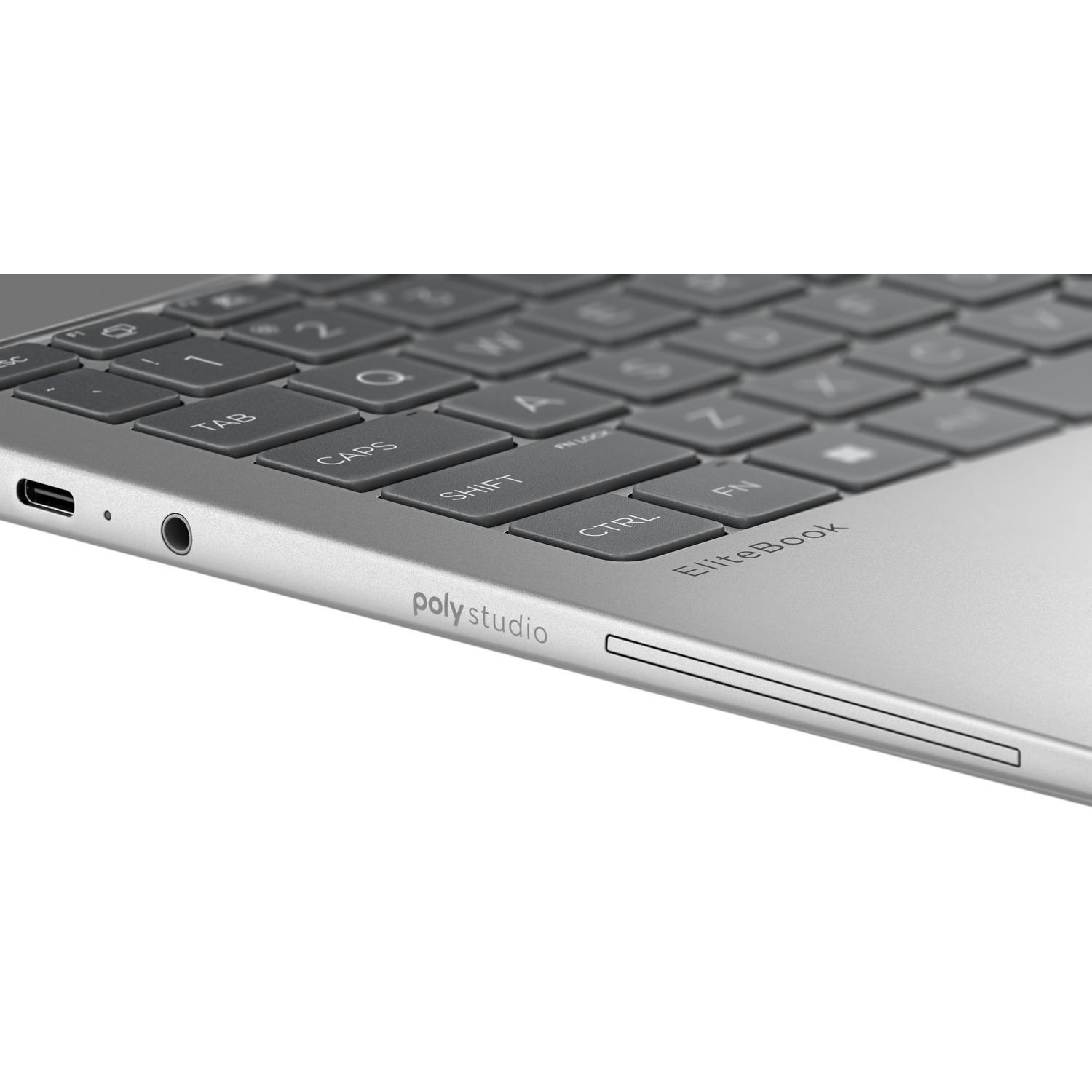 Close-up of a silver laptop keyboard with USB-C and headphone ports.