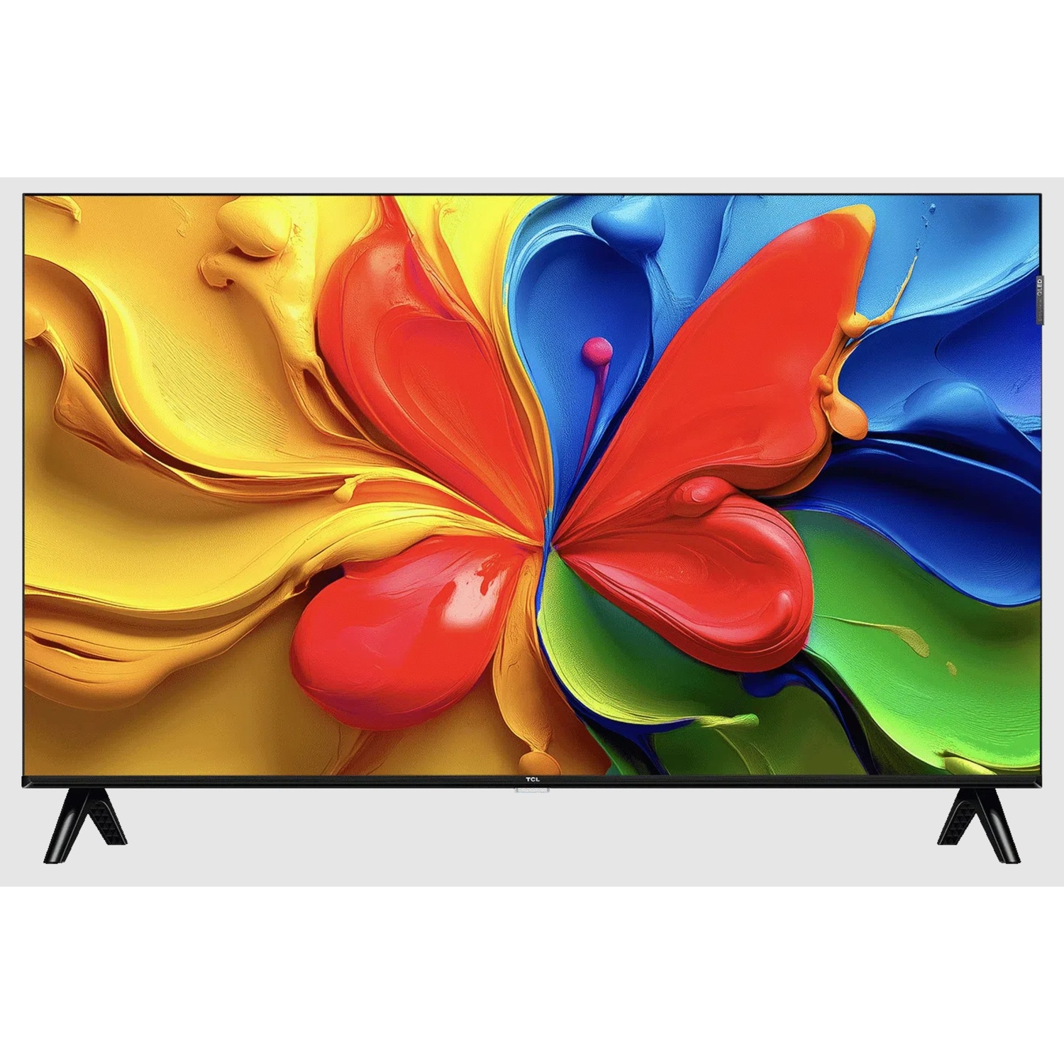 Una TV mostra un disegno astratto di farfalla fatto di vernice gialla, rossa, blu e verde.