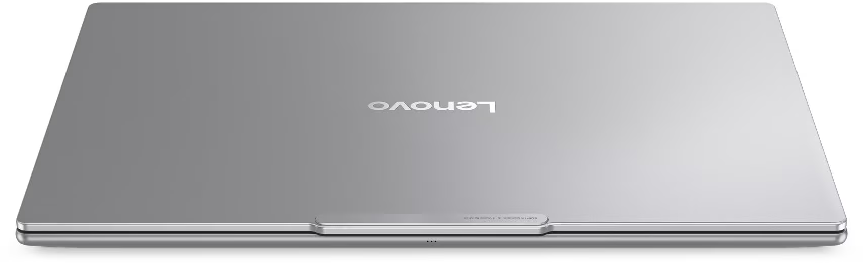 Zárt ezüst Lenovo laptop logóval a fedélen.