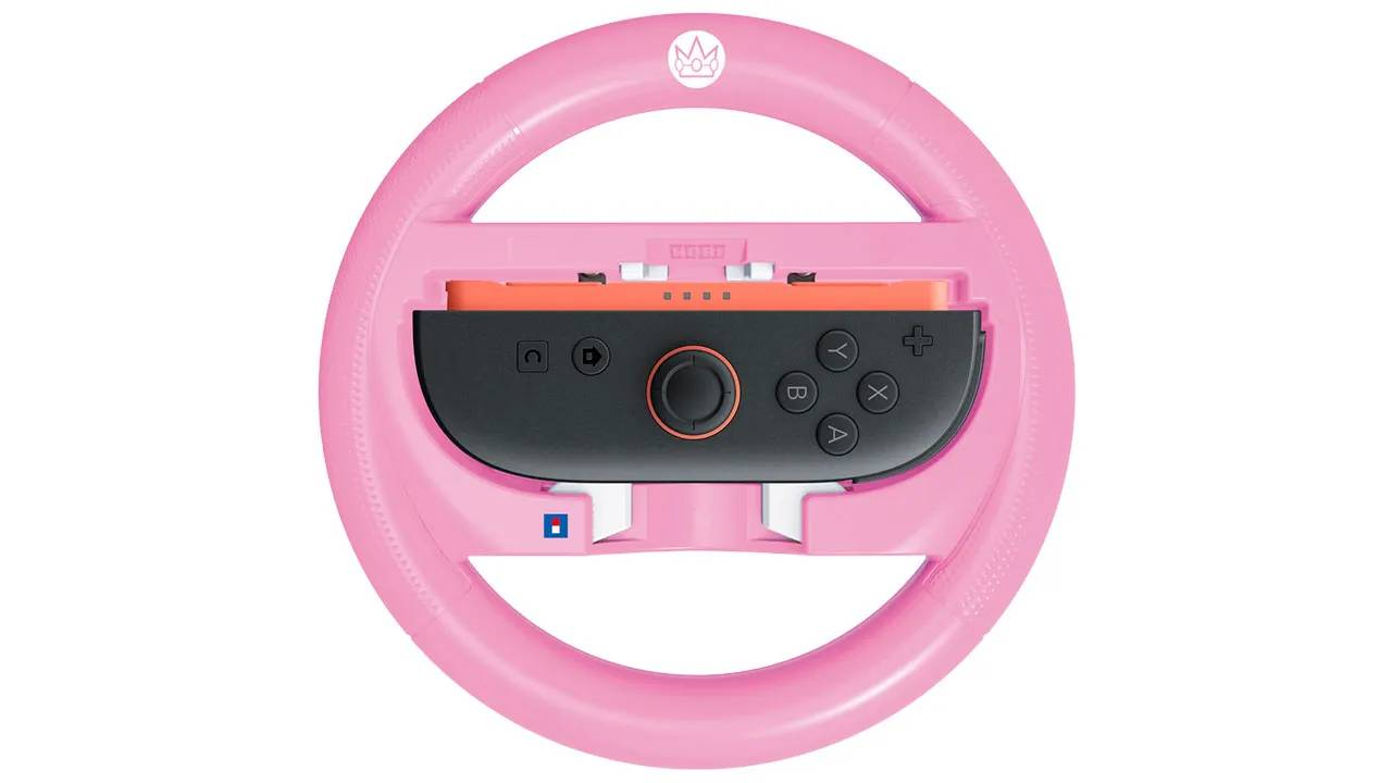 Un volante rosa para Nintendo Switch con controles negros.