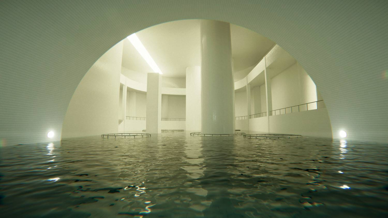 Una sala grande y alicatada llena de agua, con columnas y barandillas redondas.