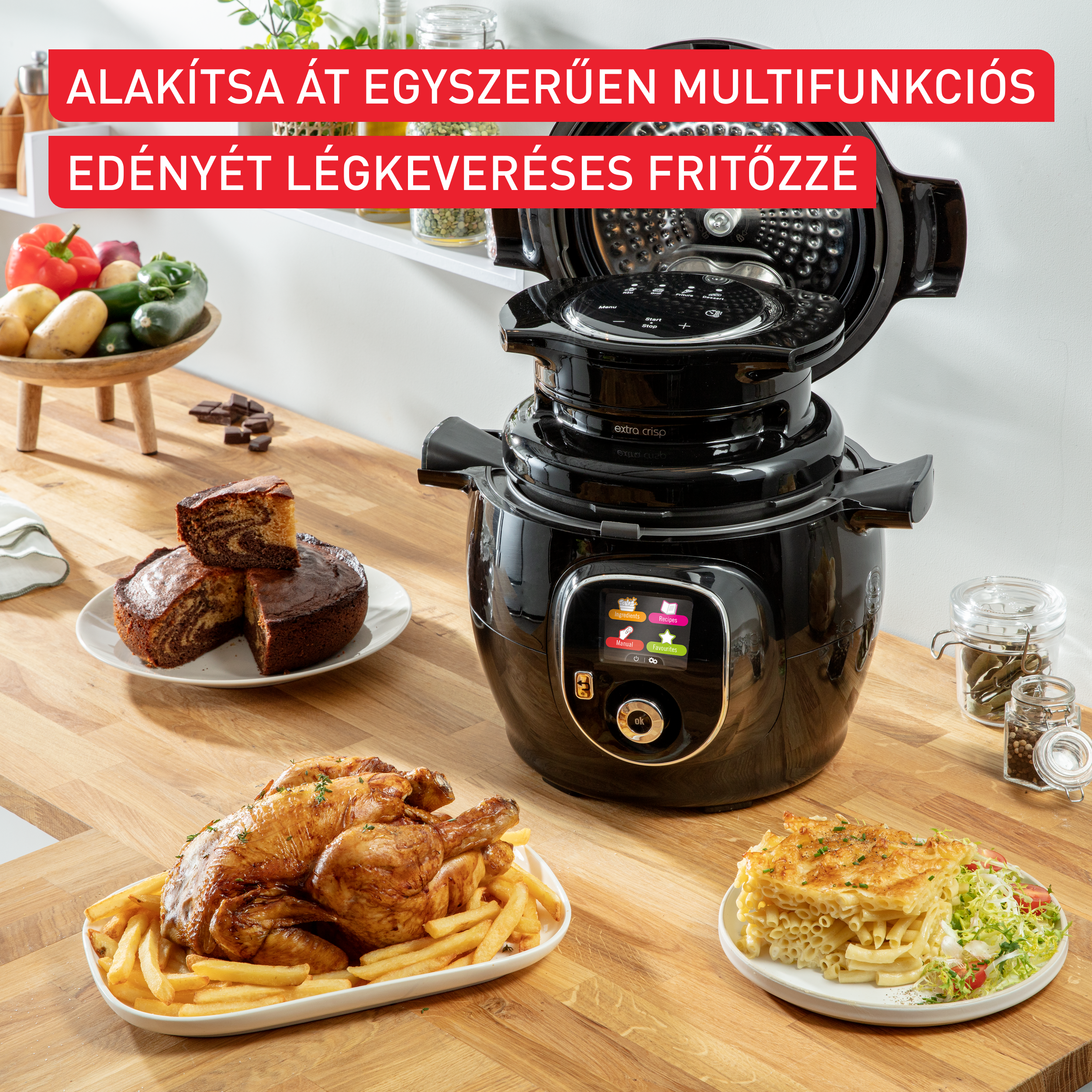 Fekete légkeveréses fritőzgép ételekkel és hozzávalókkal körítve.