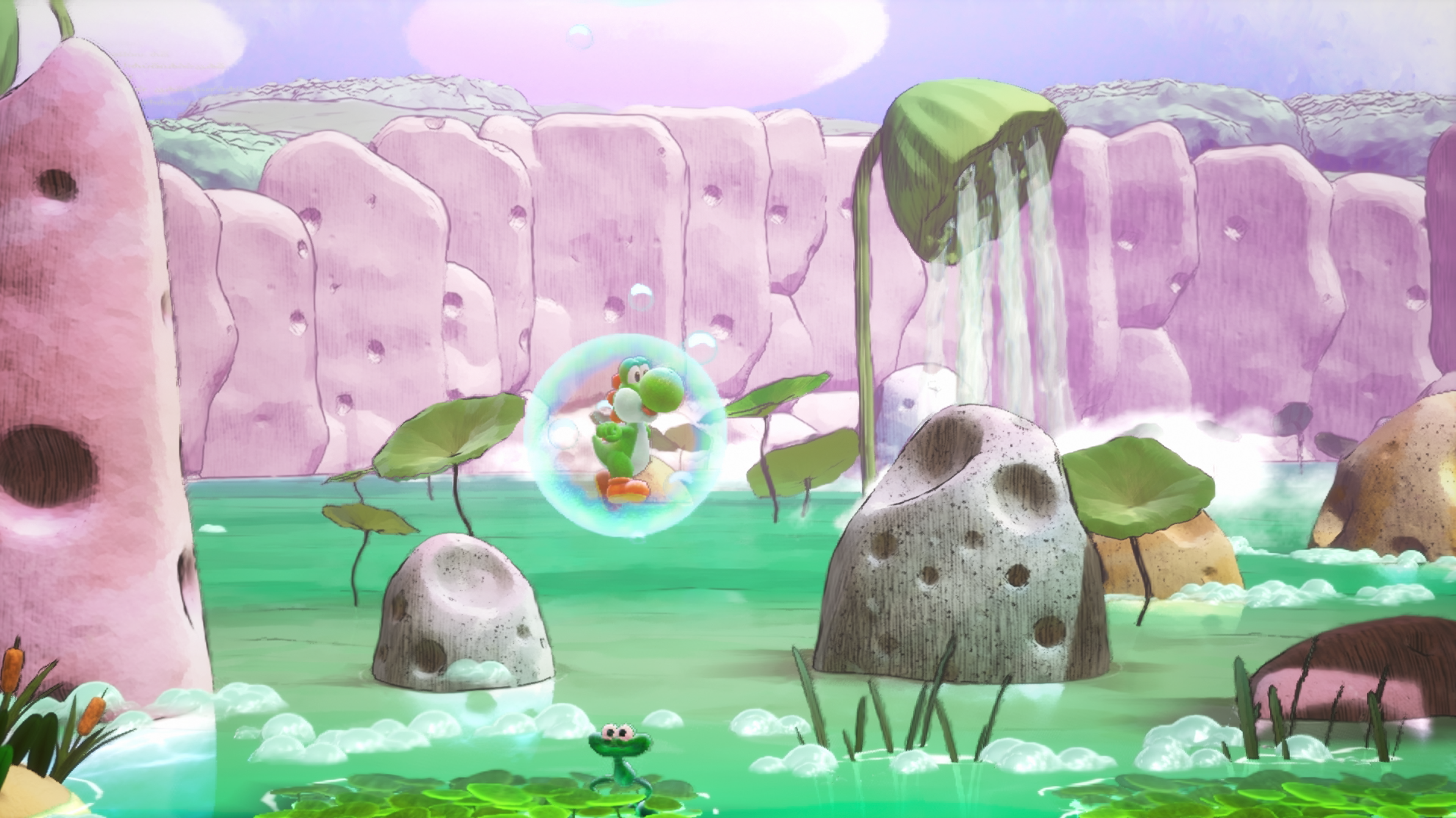 Yoshi flotte dans une bulle sur de l'eau verte. Rochers roses et cascades en arrière-plan.
