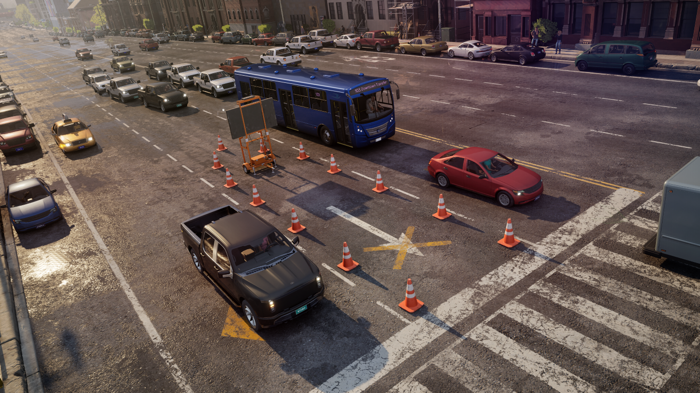 Niebieski pas autobusowy z pachołkami i samochodami w mieście.