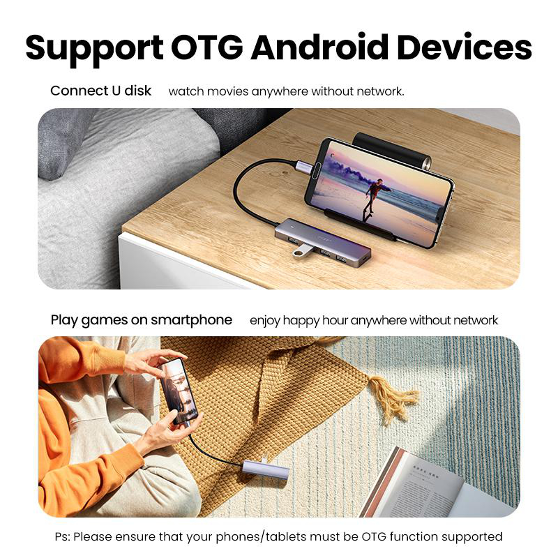 Ein Smartphone und ein Hub sind auf einem Holztisch verbunden. Ein anderes Smartphone wird gehalten.