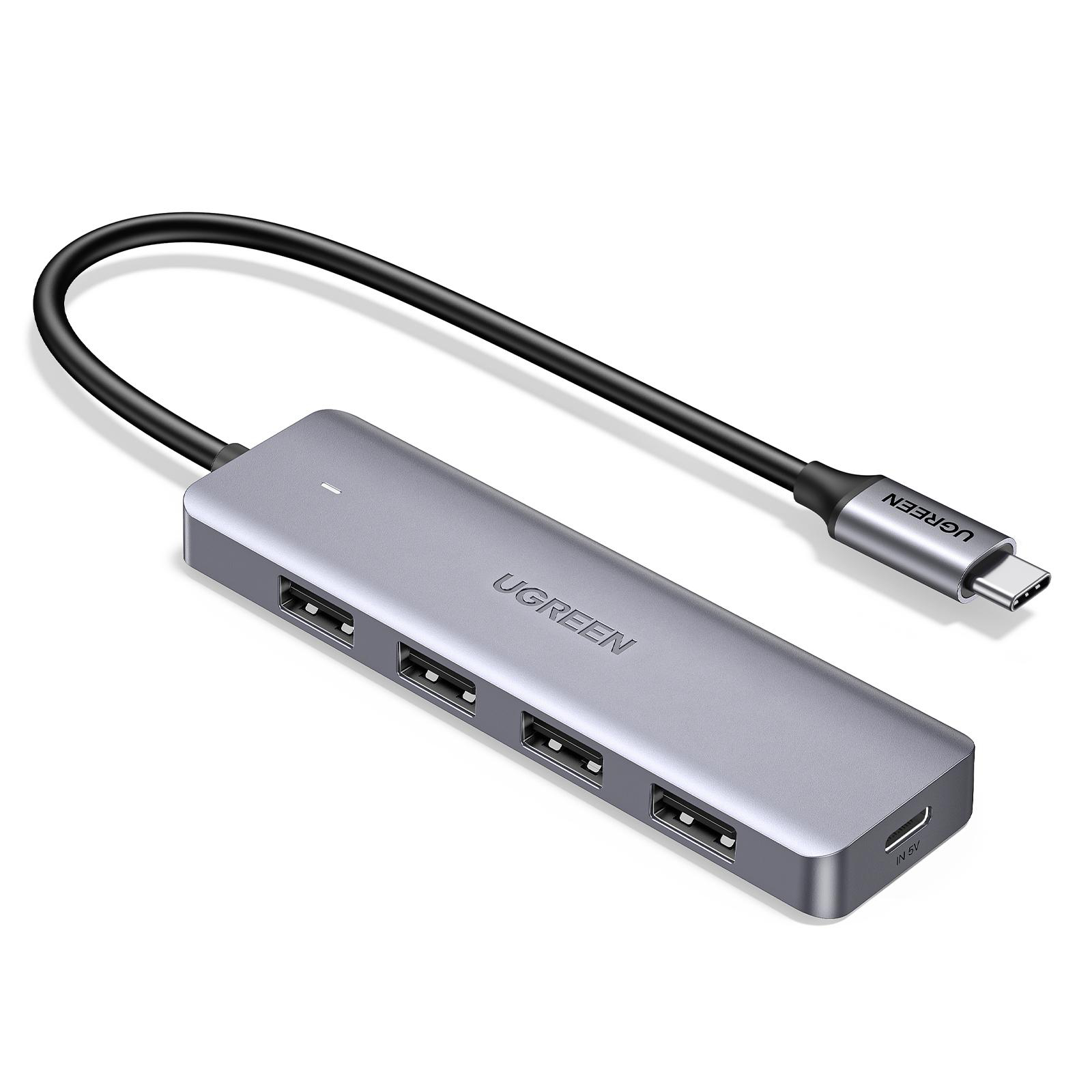 Grauer USB-C-Hub mit vier USB-A-Anschlüssen und einem Ladeanschluss.