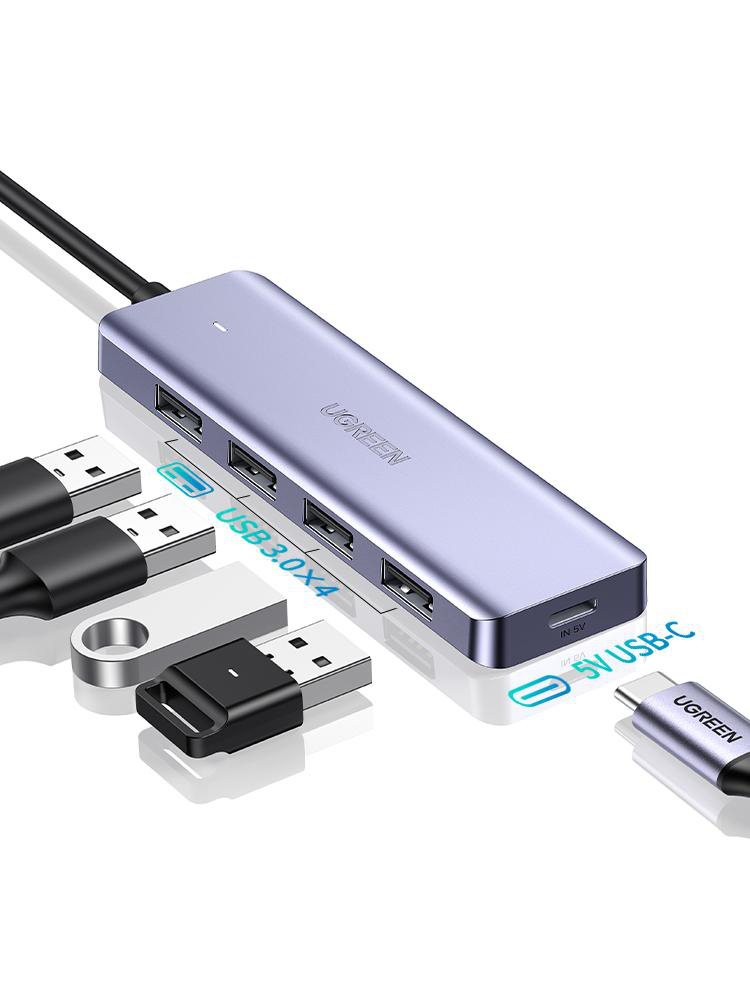 Ein silberner USB-C-Hub mit vier USB 3.0-Anschlüssen und einem USB-C-Eingang.