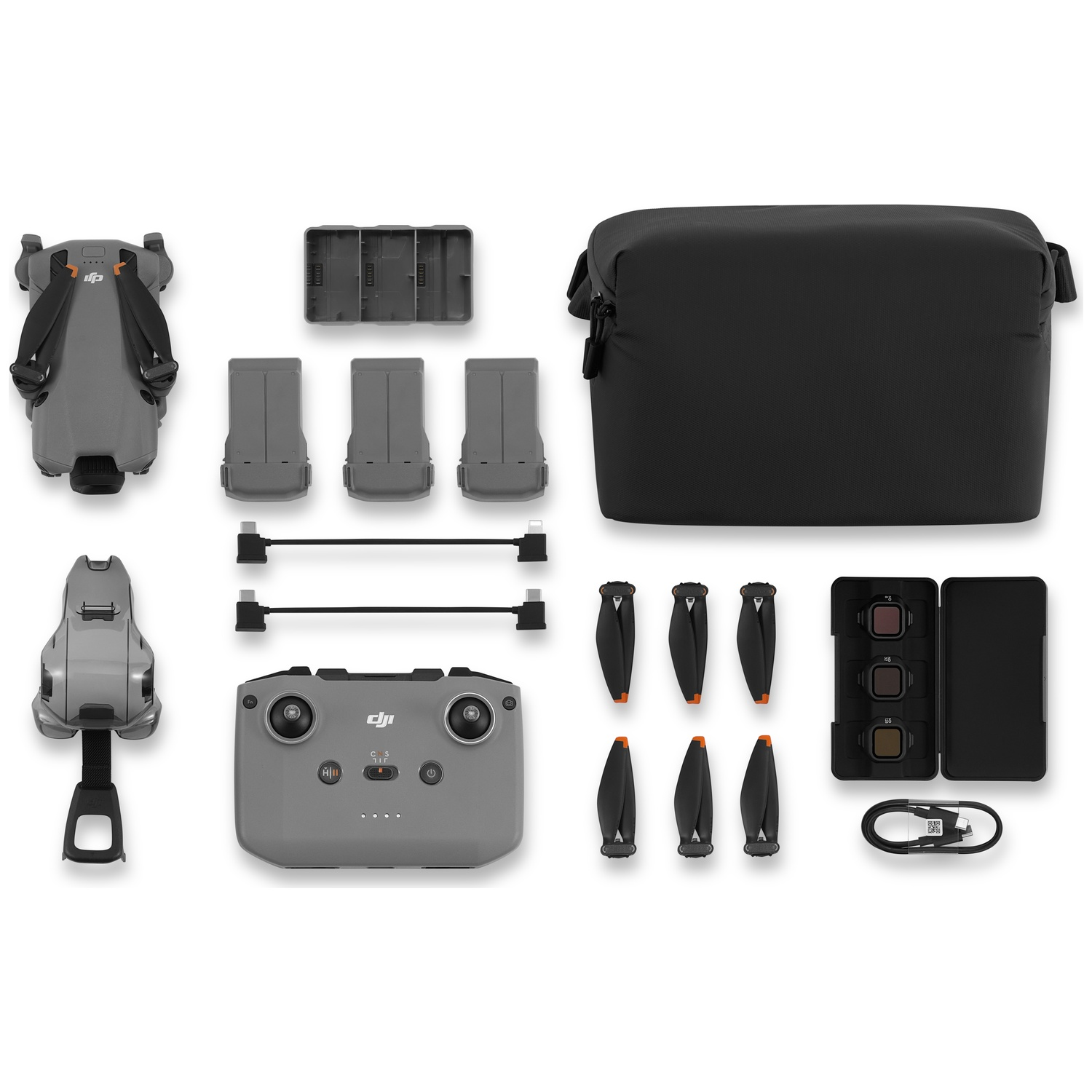 Gray DJI drone kit with accessories: drone, remote, batteries, propellers, bag.