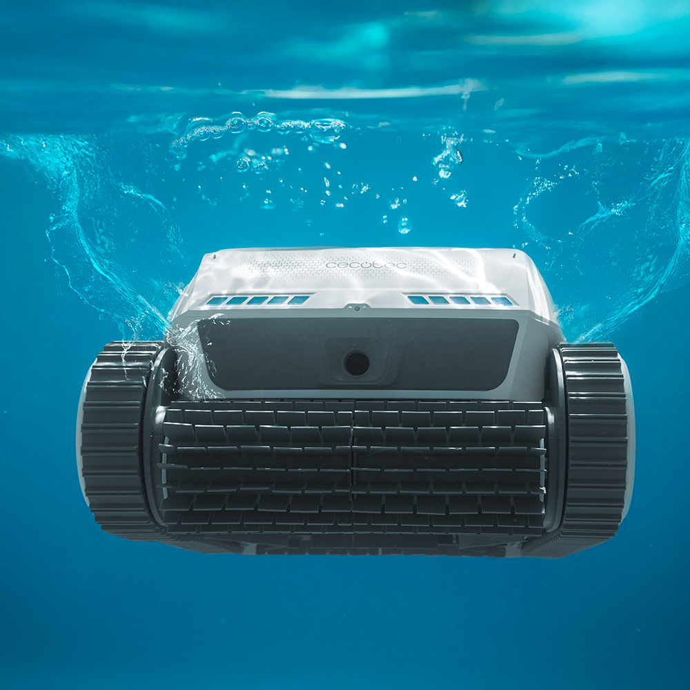 Un robot de piscina blanco con orugas de goma se sumerge.