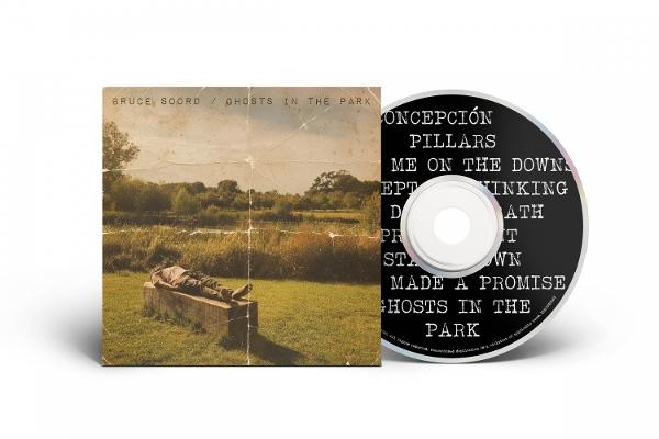 CD-Cover: Mann liegt auf Betonblock in Gras, daneben CD.