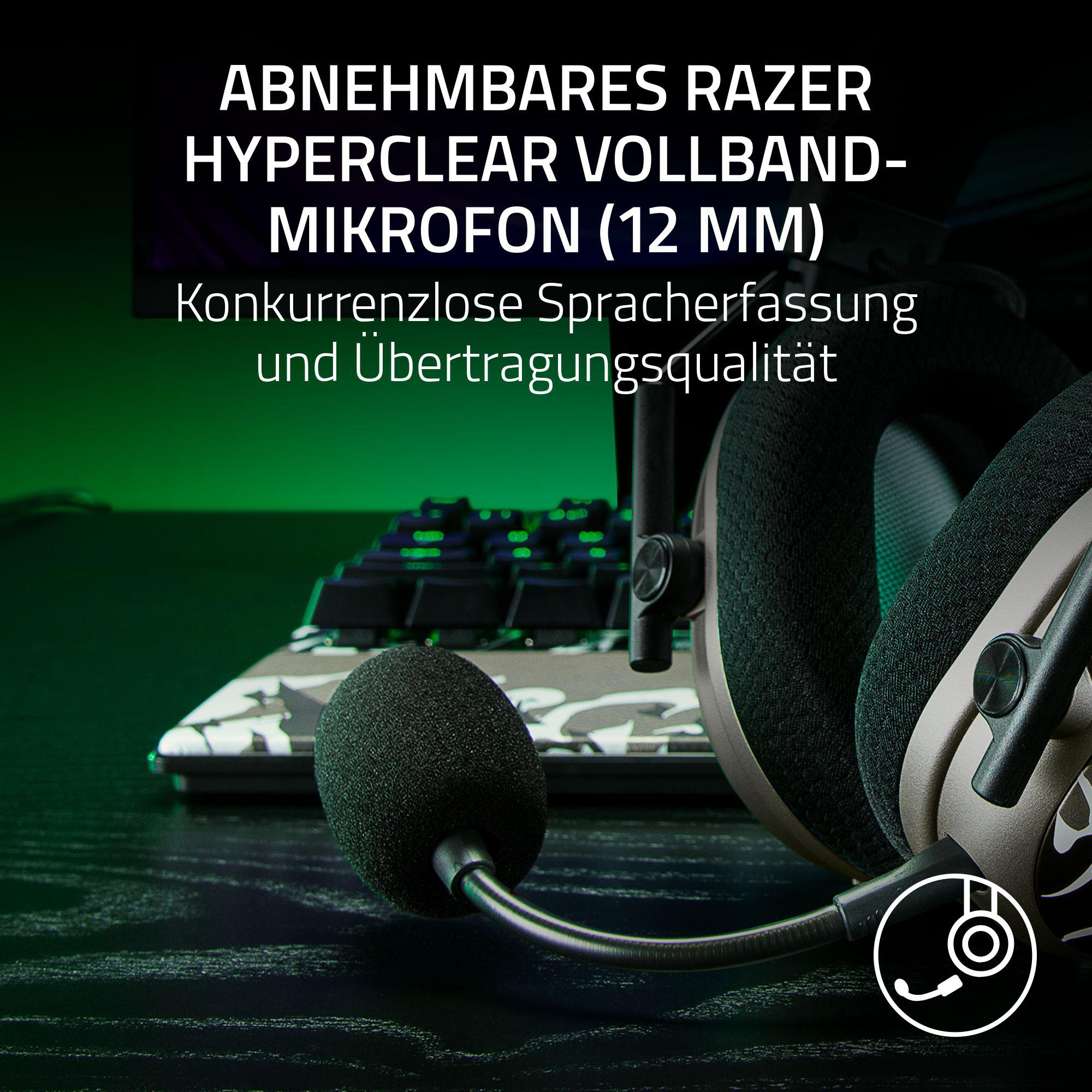 Razer Kopfhörer mit abnehmbarem Mikrofon und Tastatur im Hintergrund.