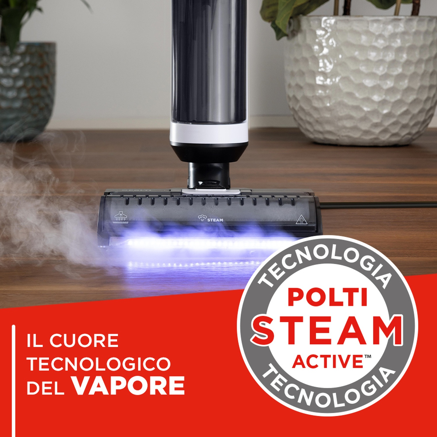 Un pulitore a vapore con luci LED blu su un pavimento in legno.