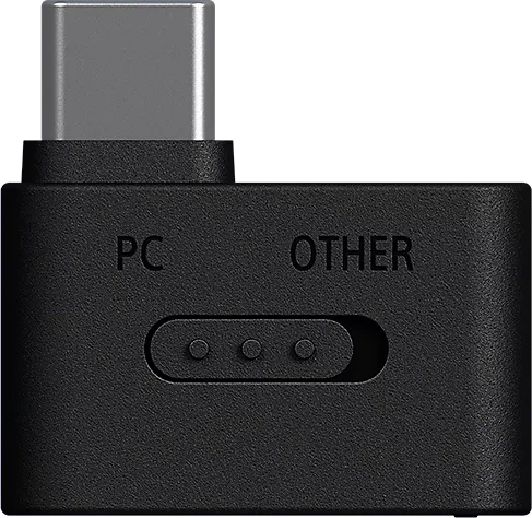 Egy fekete USB-C adapter kapcsolóval, "PC" és "OTHER" feliratokkal.