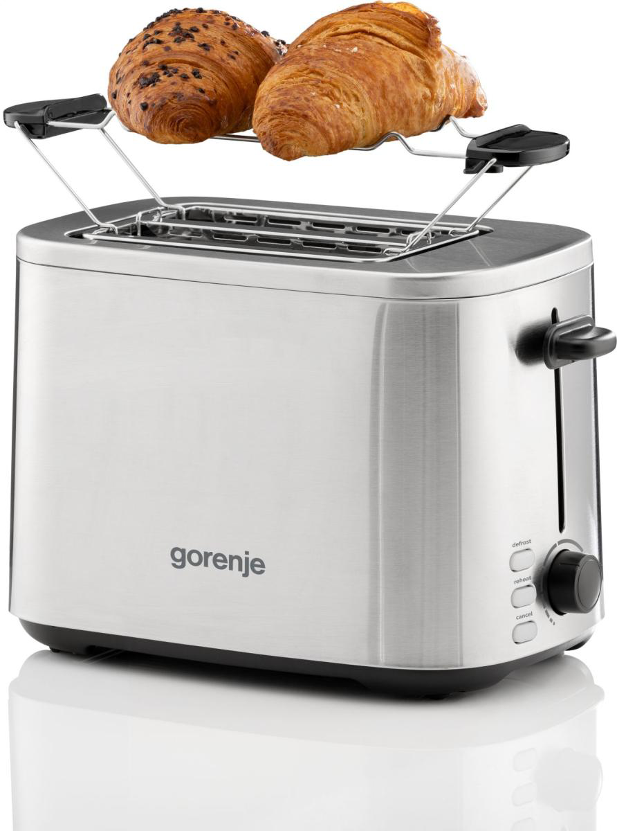 Ezüst pirítós, melyen egy rácson két croissant pihen.