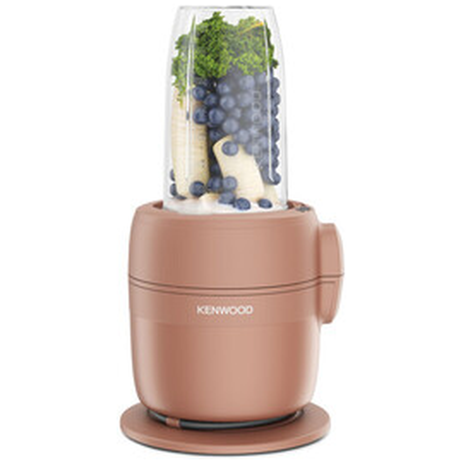 A rose gold Kenwood blender with banana, blueberries, and kale in the jar.