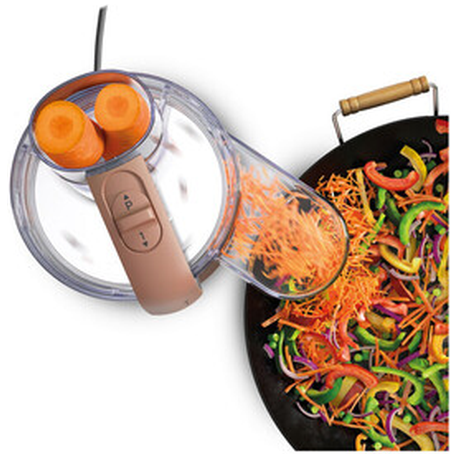 Carrots are being shredded into a wok with vegetables.