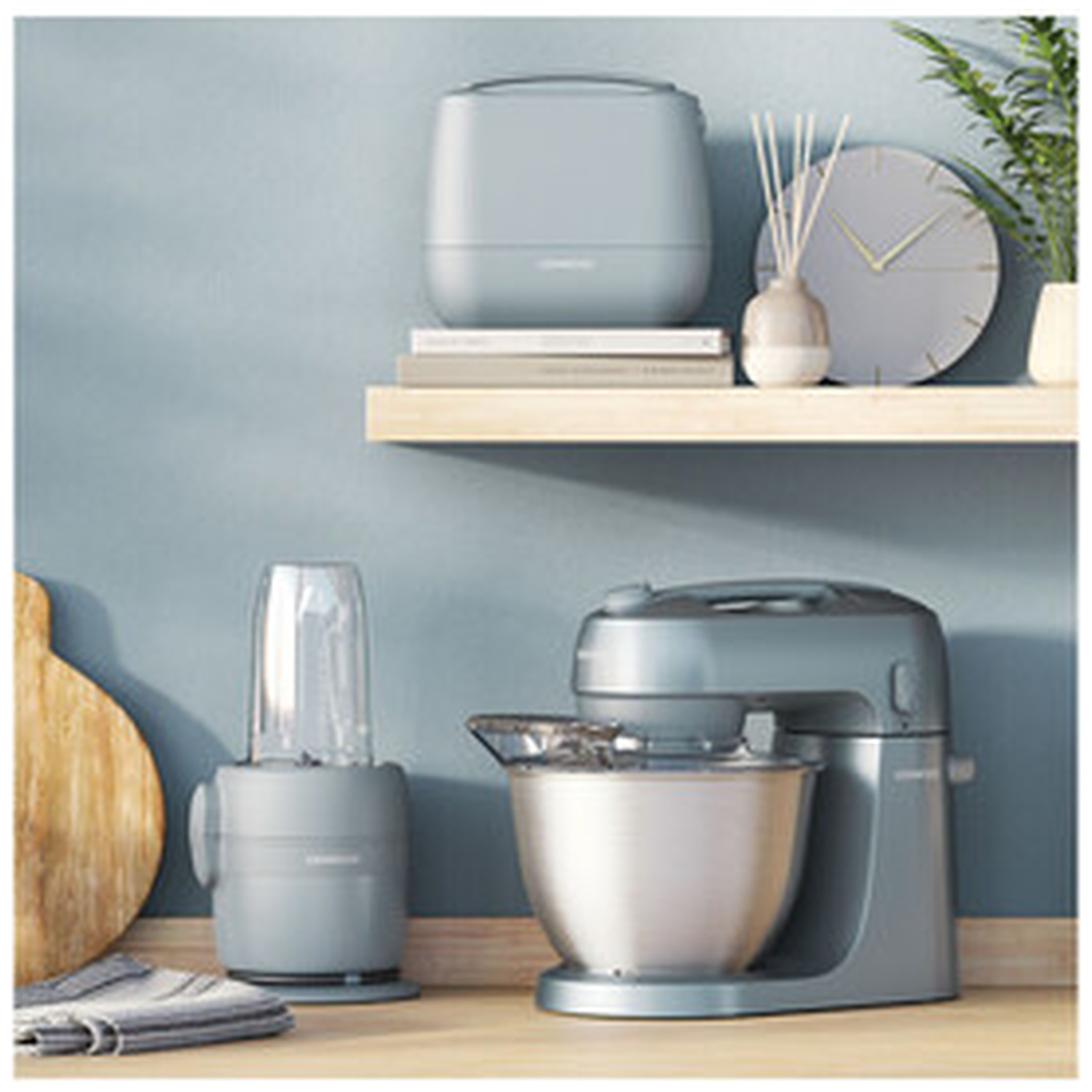 Grey kitchen appliances: stand mixer, blender, and an item on a shelf.