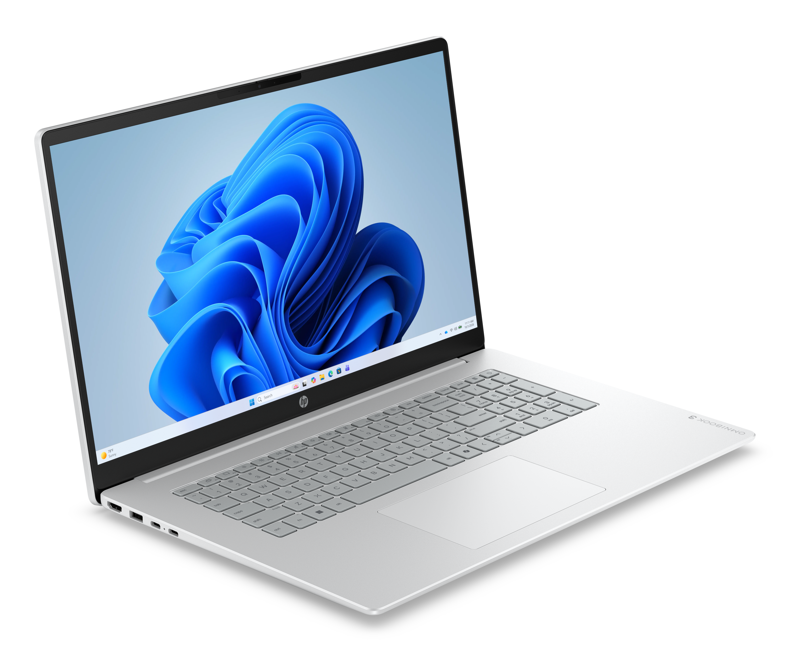 Ein geöffneter silberner Laptop mit Windows 11 und blauer Wellen-Hintergrundgrafik.