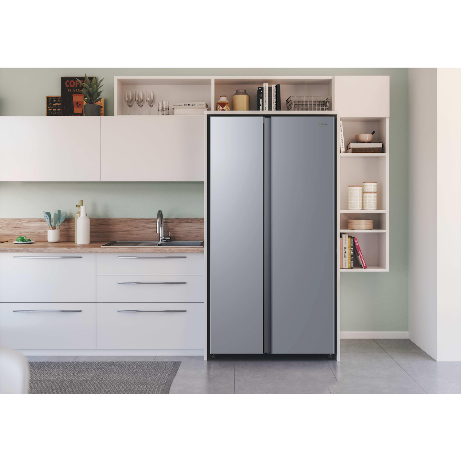 Un frigorifero argentato in una cucina moderna con mobili bianchi e piani di lavoro in legno.